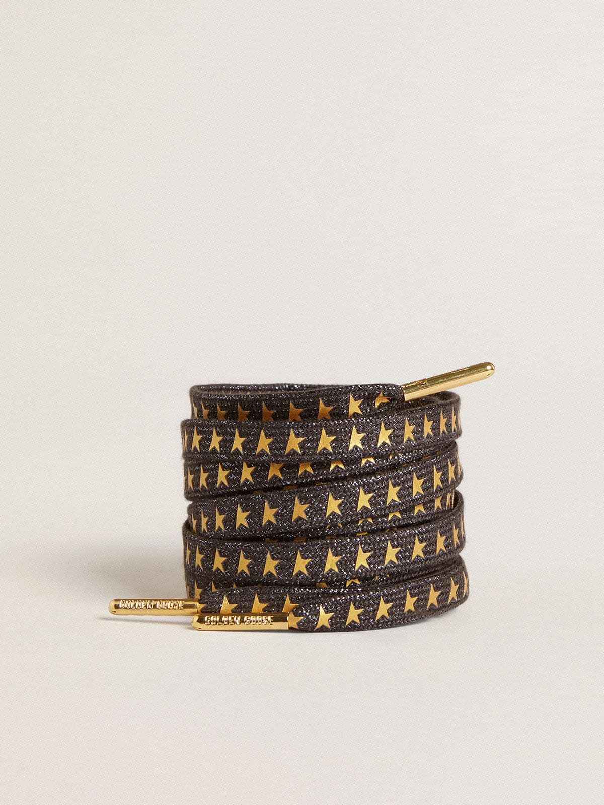 Dark gray Lurex laces with contrasting gold stars