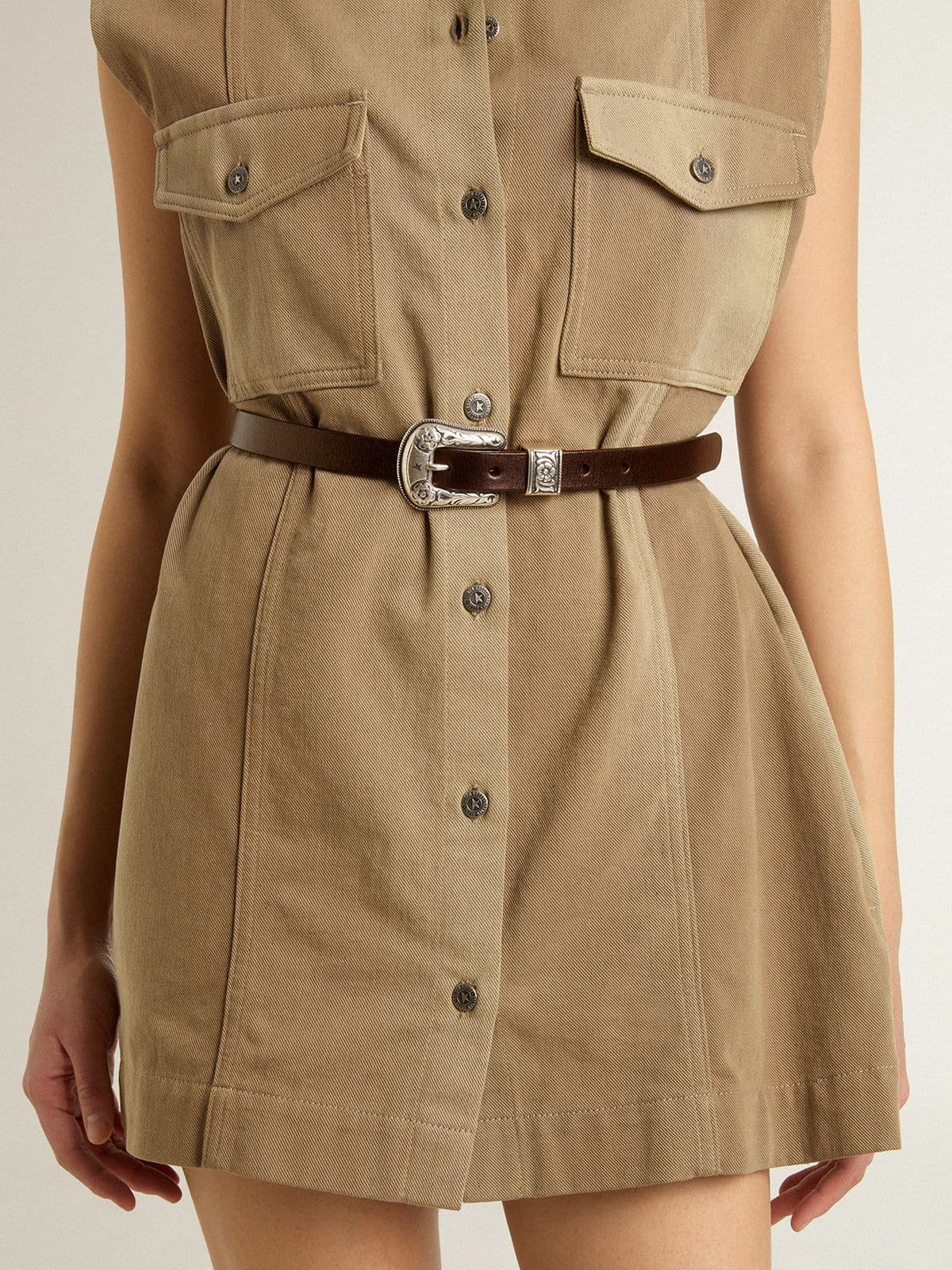 Women's dark brown leather belt with decorated silver buckle