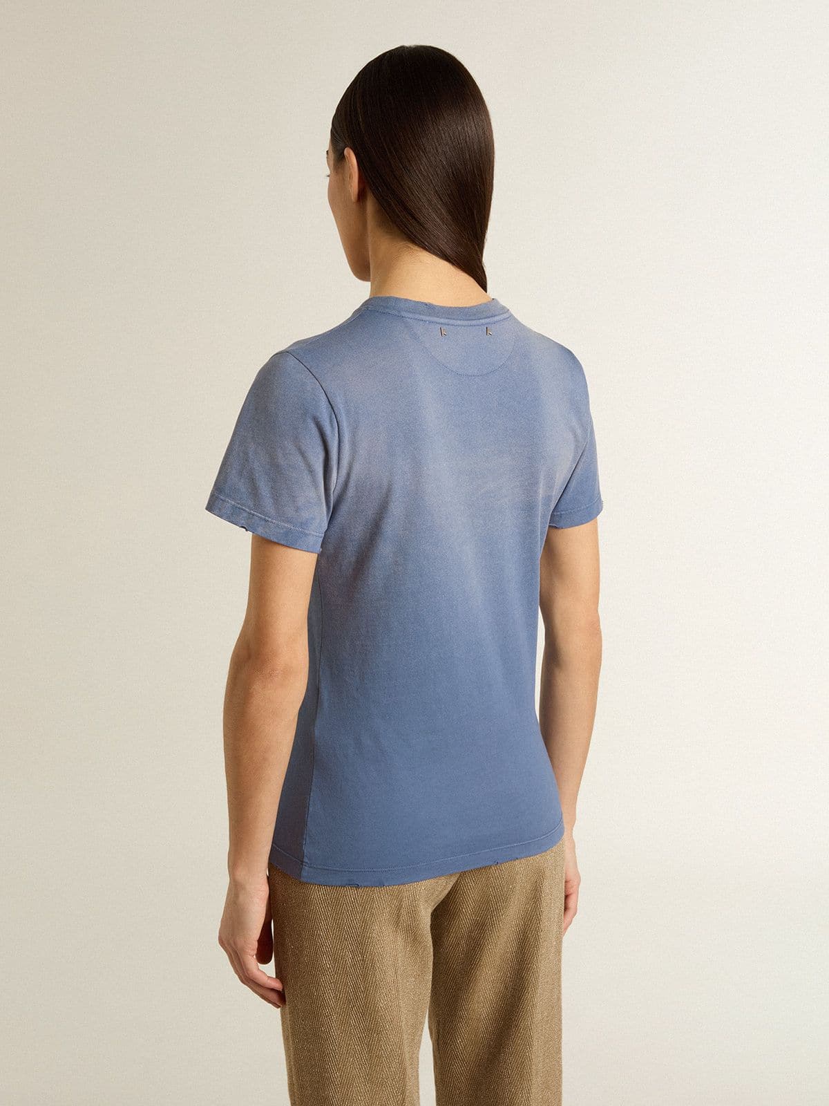 Women's faded light blue T-shirt with print on the chest