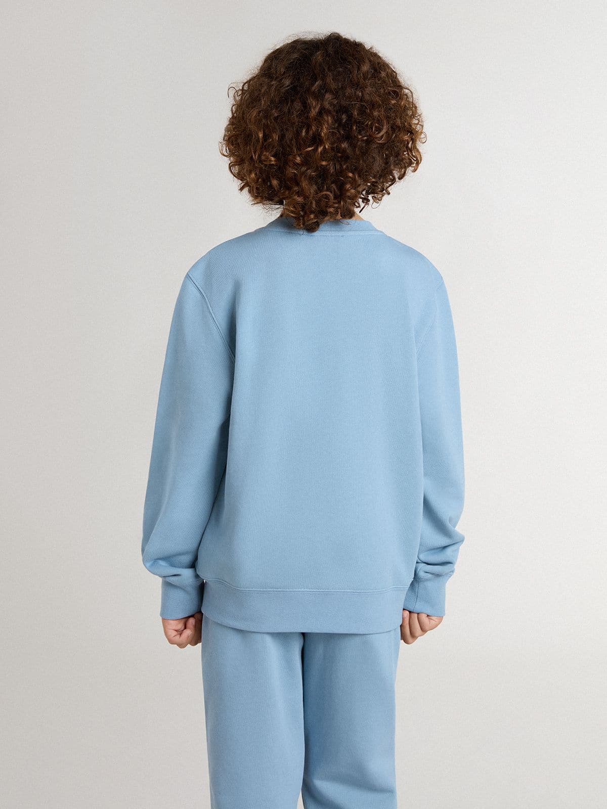 Boys' light blue sweatshirt with lettering on the front
