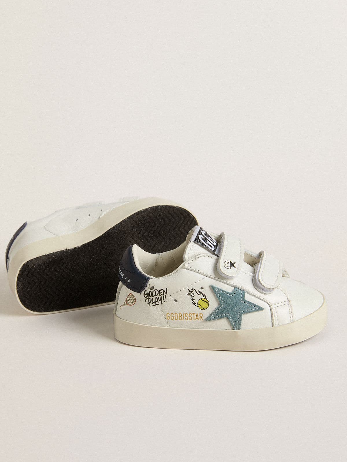 Baby School in white nappa with light blue suede star and tennis motif