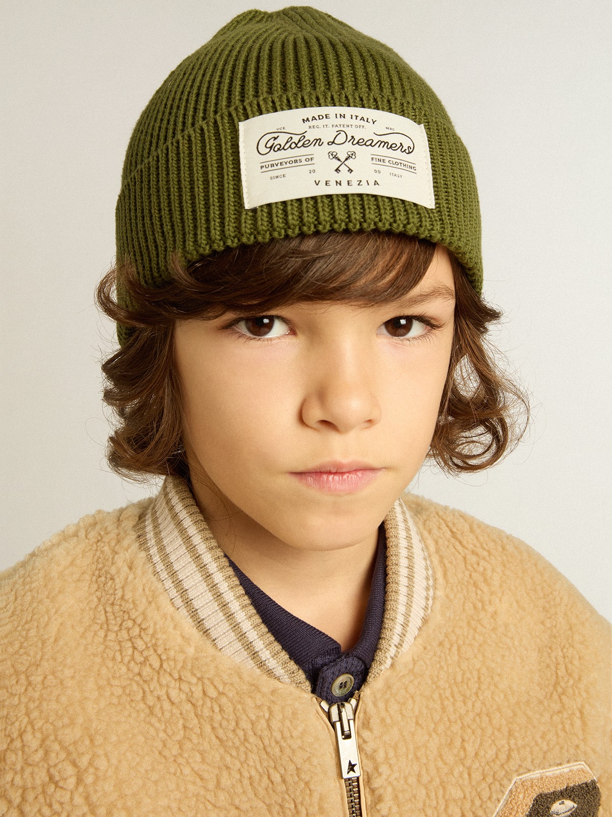 Military-green cotton beanie with appliqué label on the front