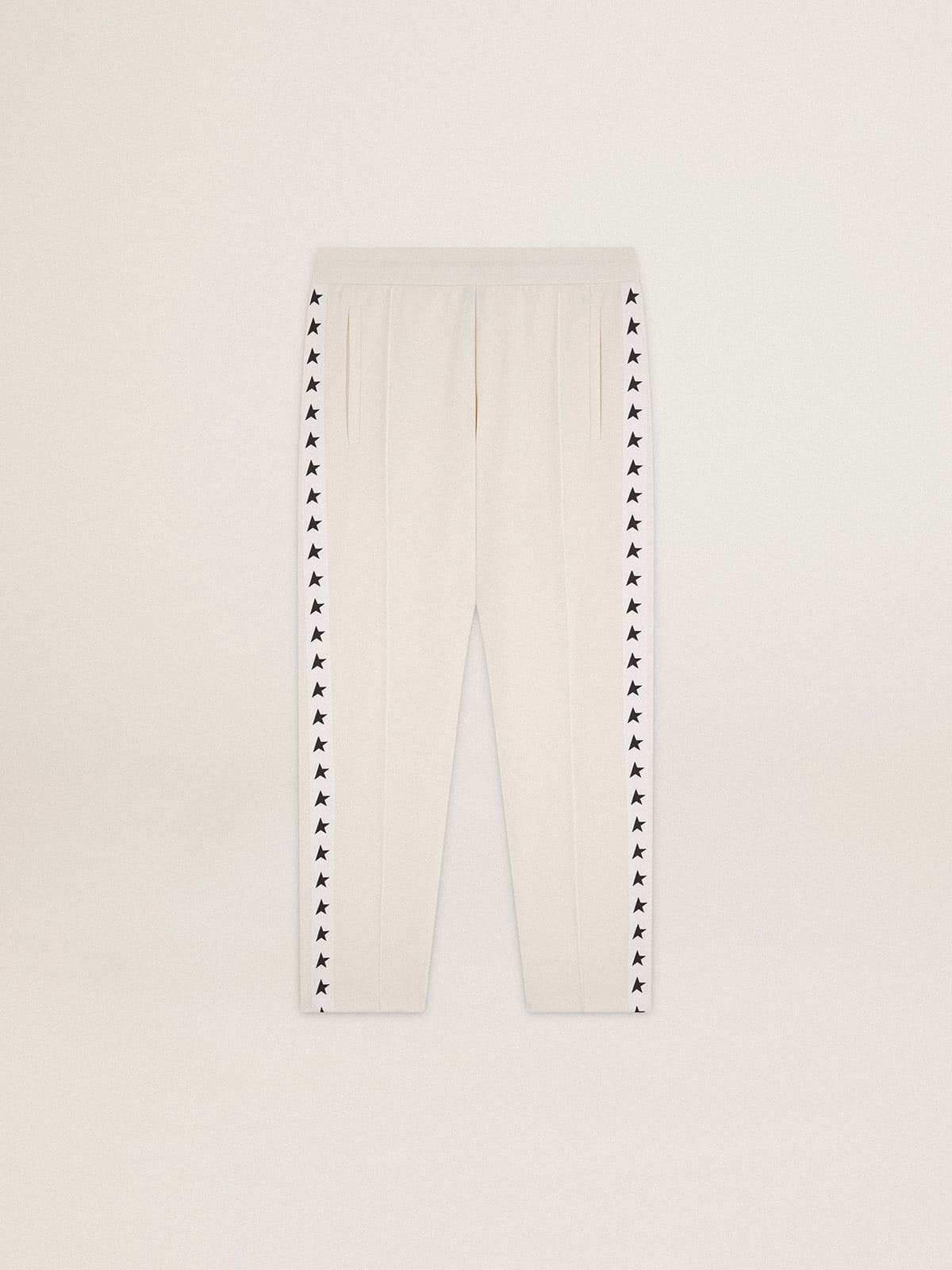 Men's white joggers with black stars on the sides
