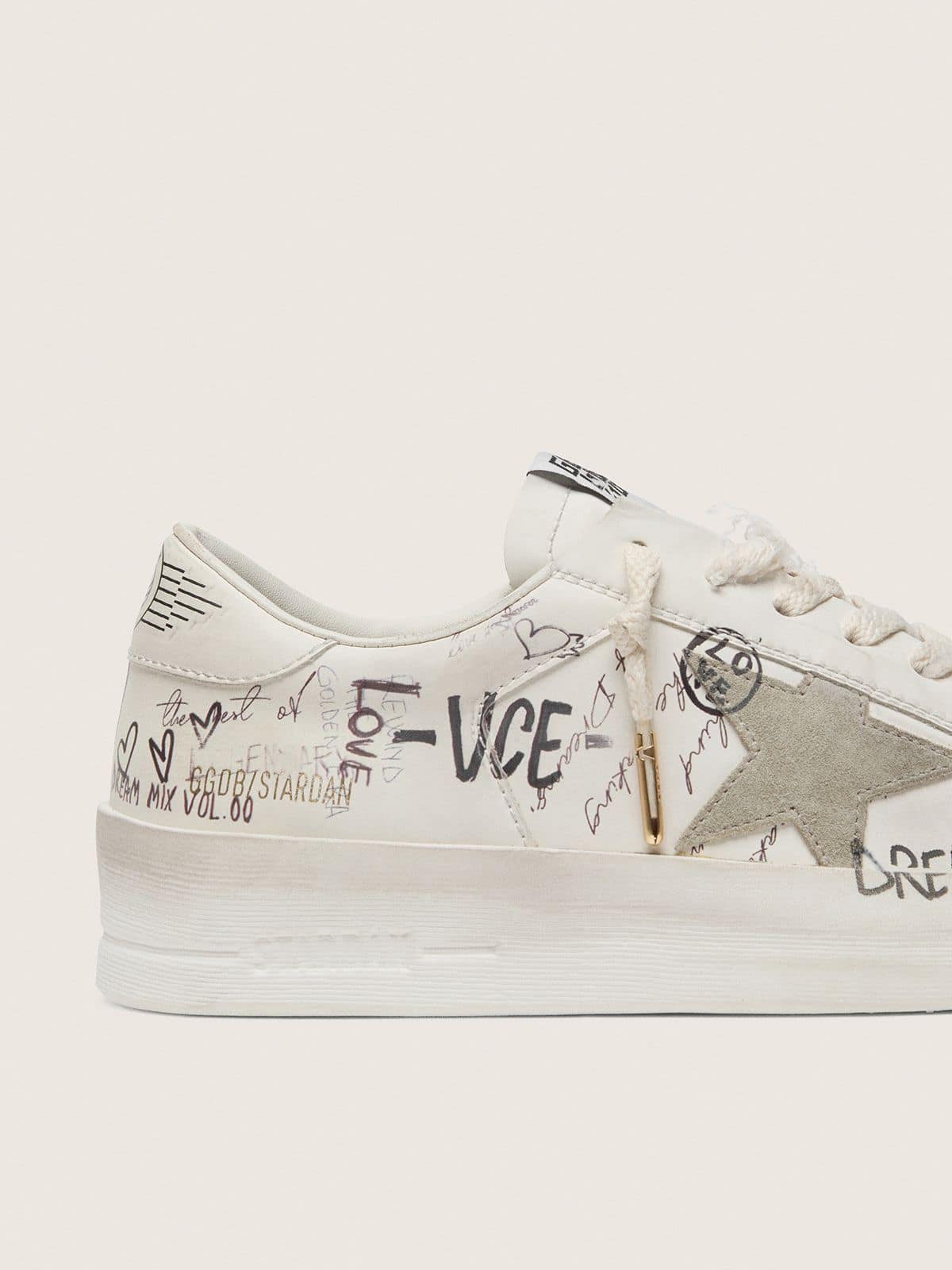 Stardan with beige suede star and toe and all-over lettering and patterns
