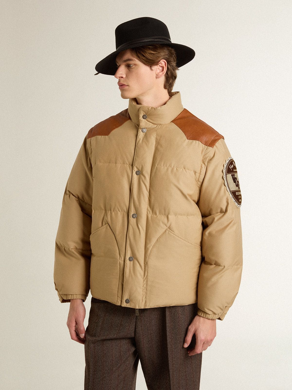 Beige bomber jacket with leather and patch details