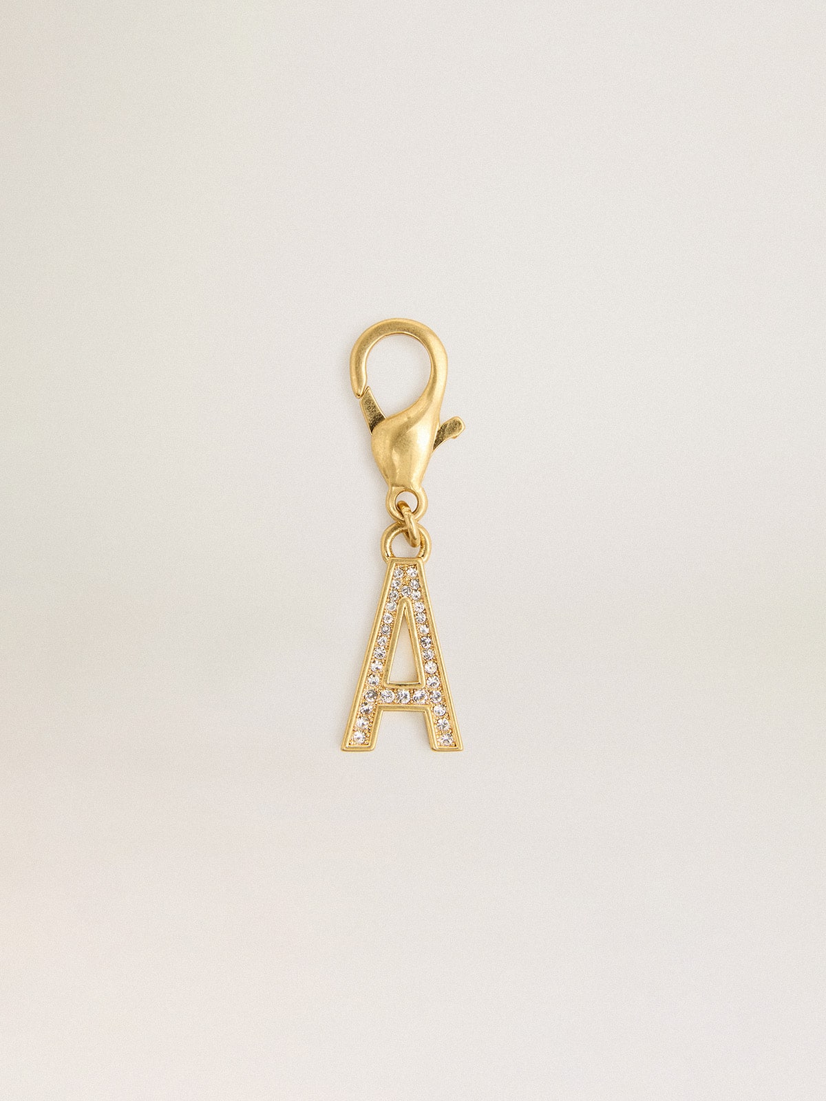 Letter A charm in gold-colored brass with crystals
