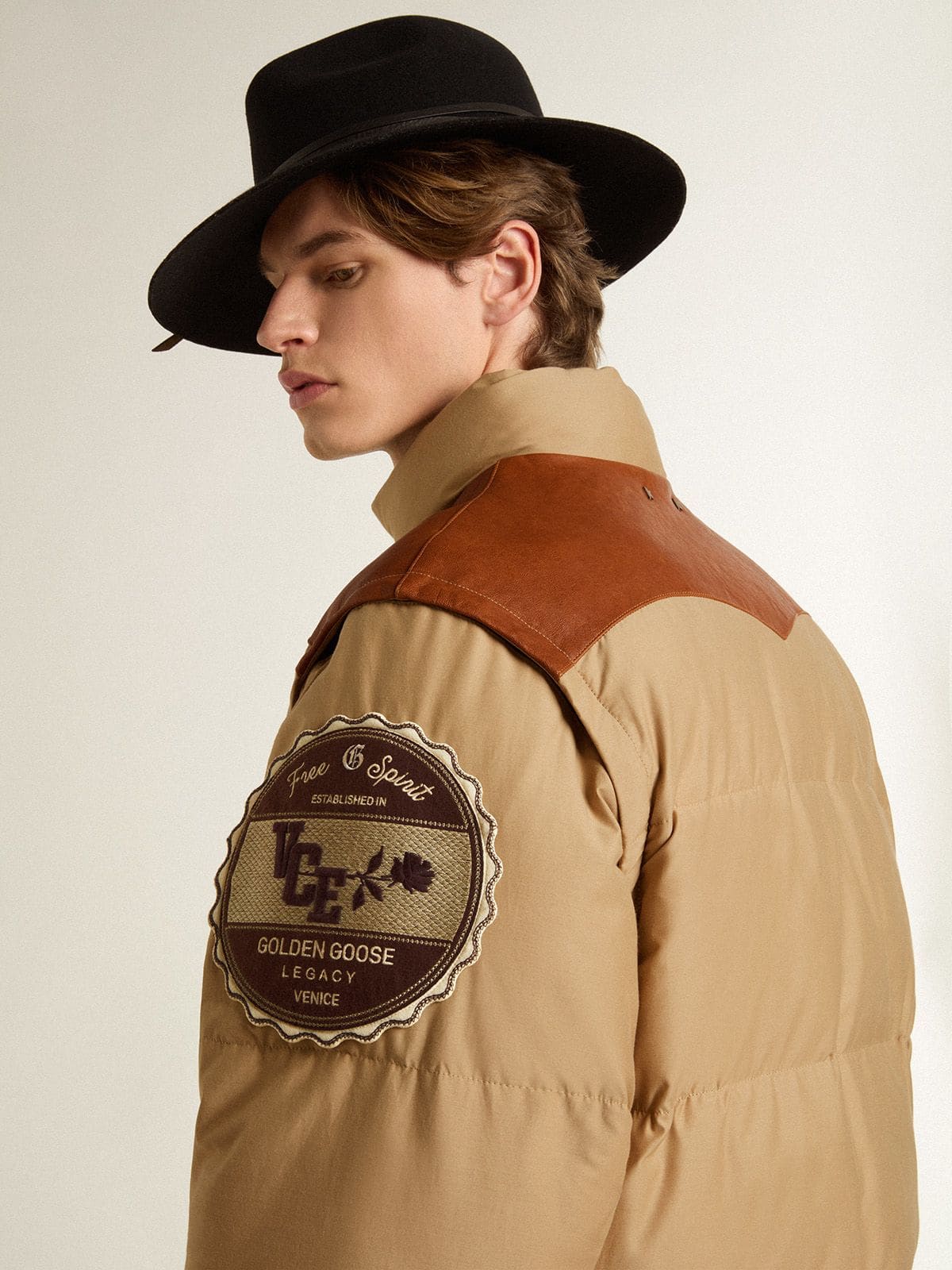 Beige bomber jacket with leather and patch details