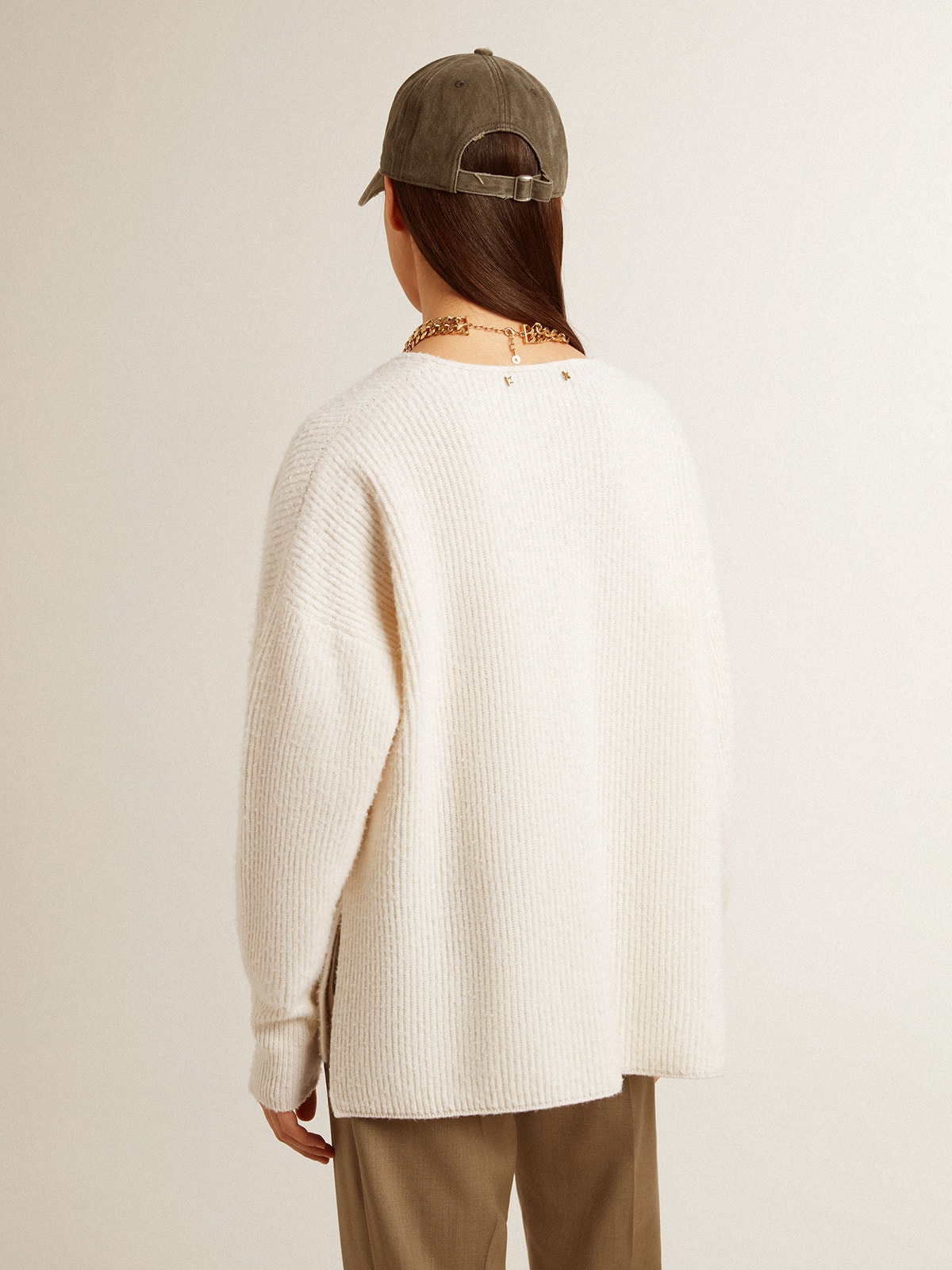 Ribbed wool sweater with V neck and drawstring with tassels
