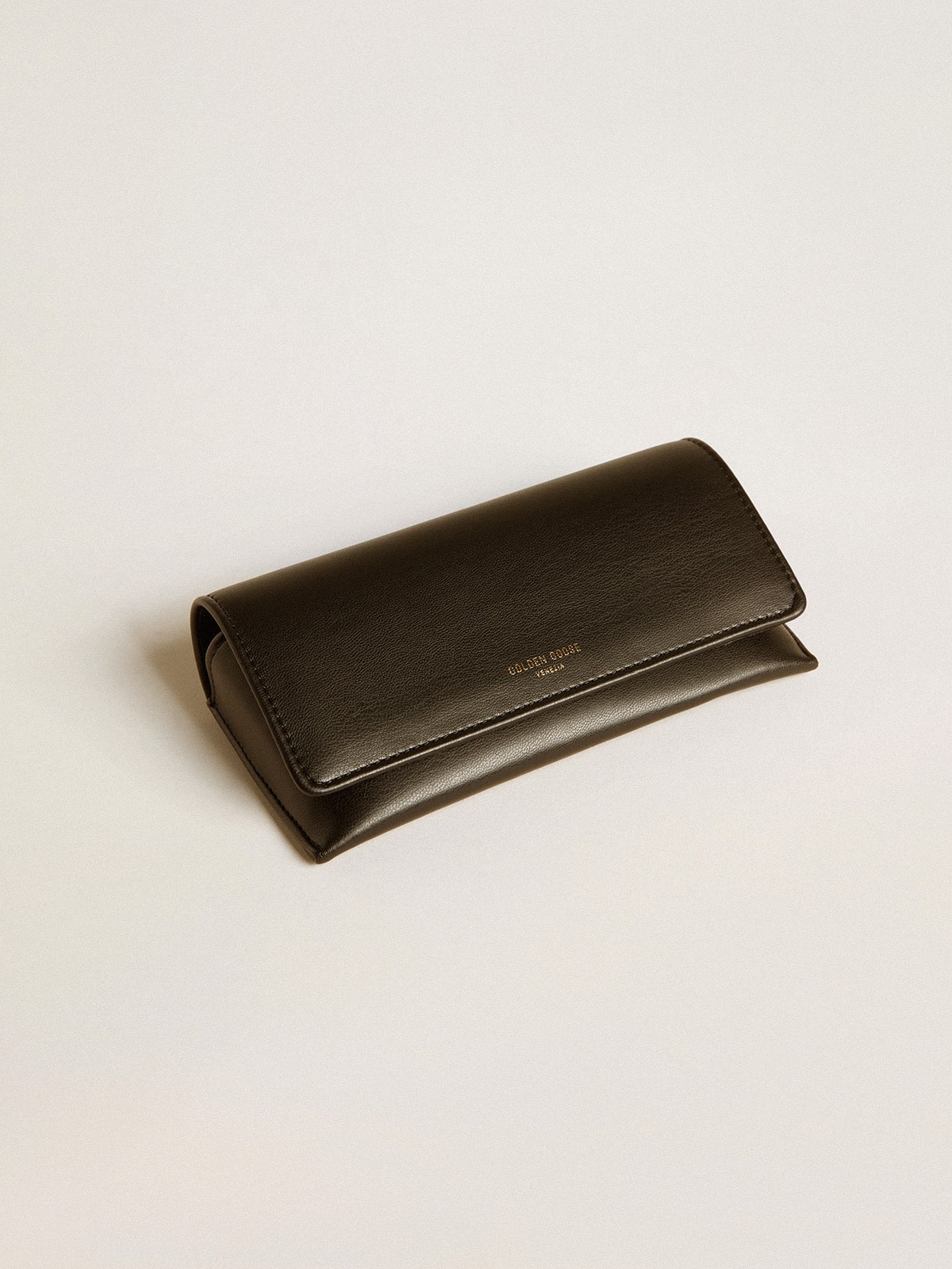 Aviator style sunglasses with black frame and lenses