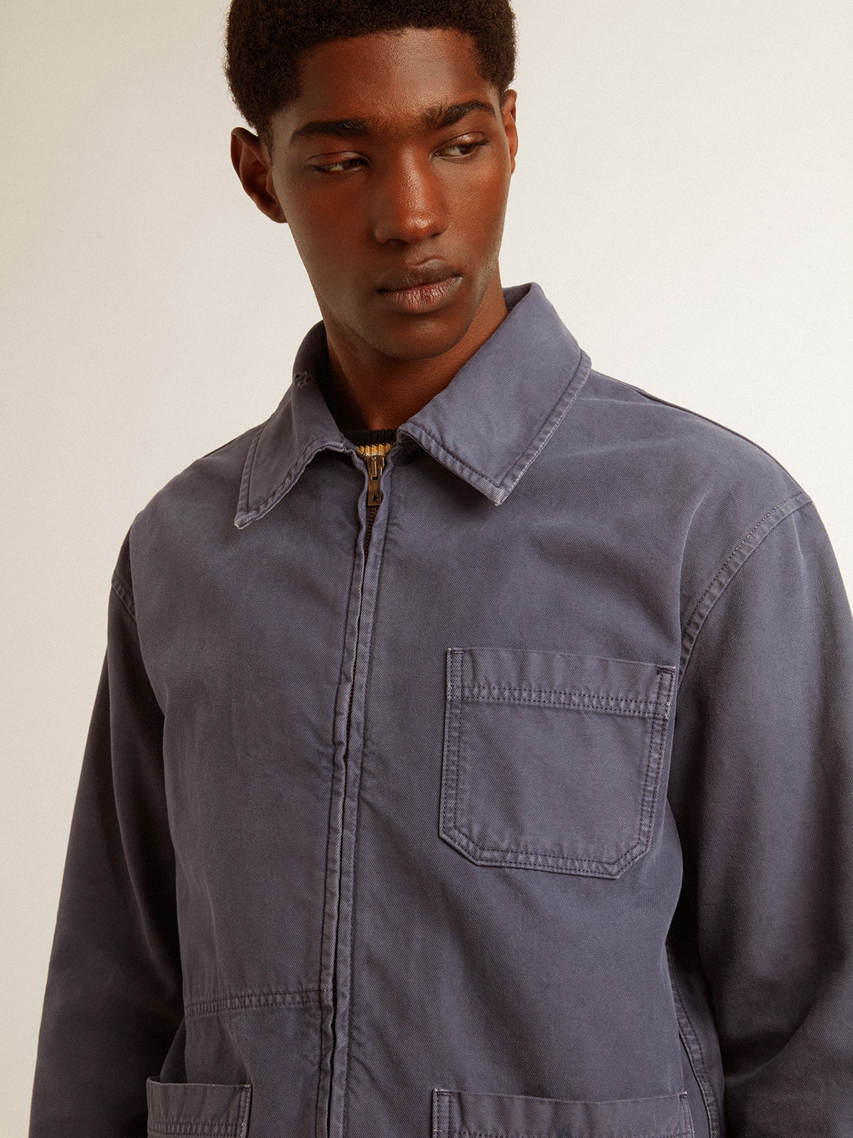 Men's blue jacket in denim cotton with distressed treatment