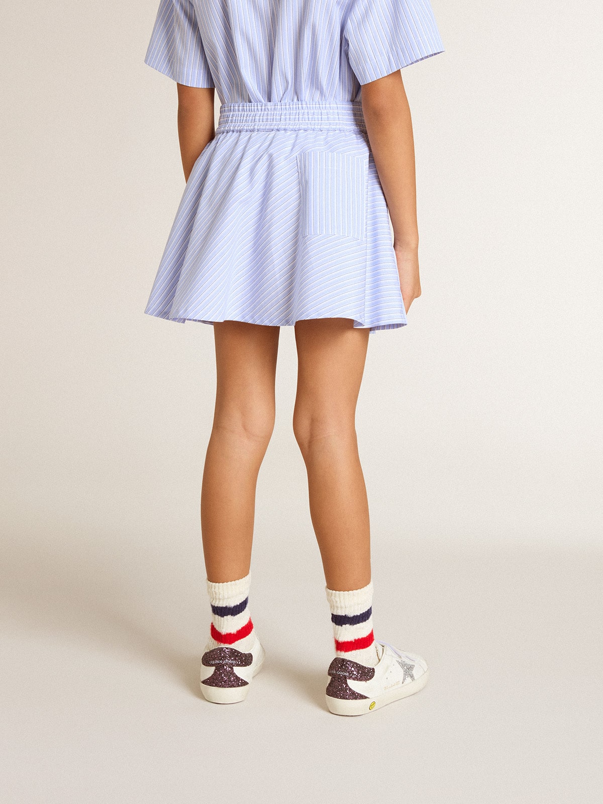 Girls' skirt with light blue stripes