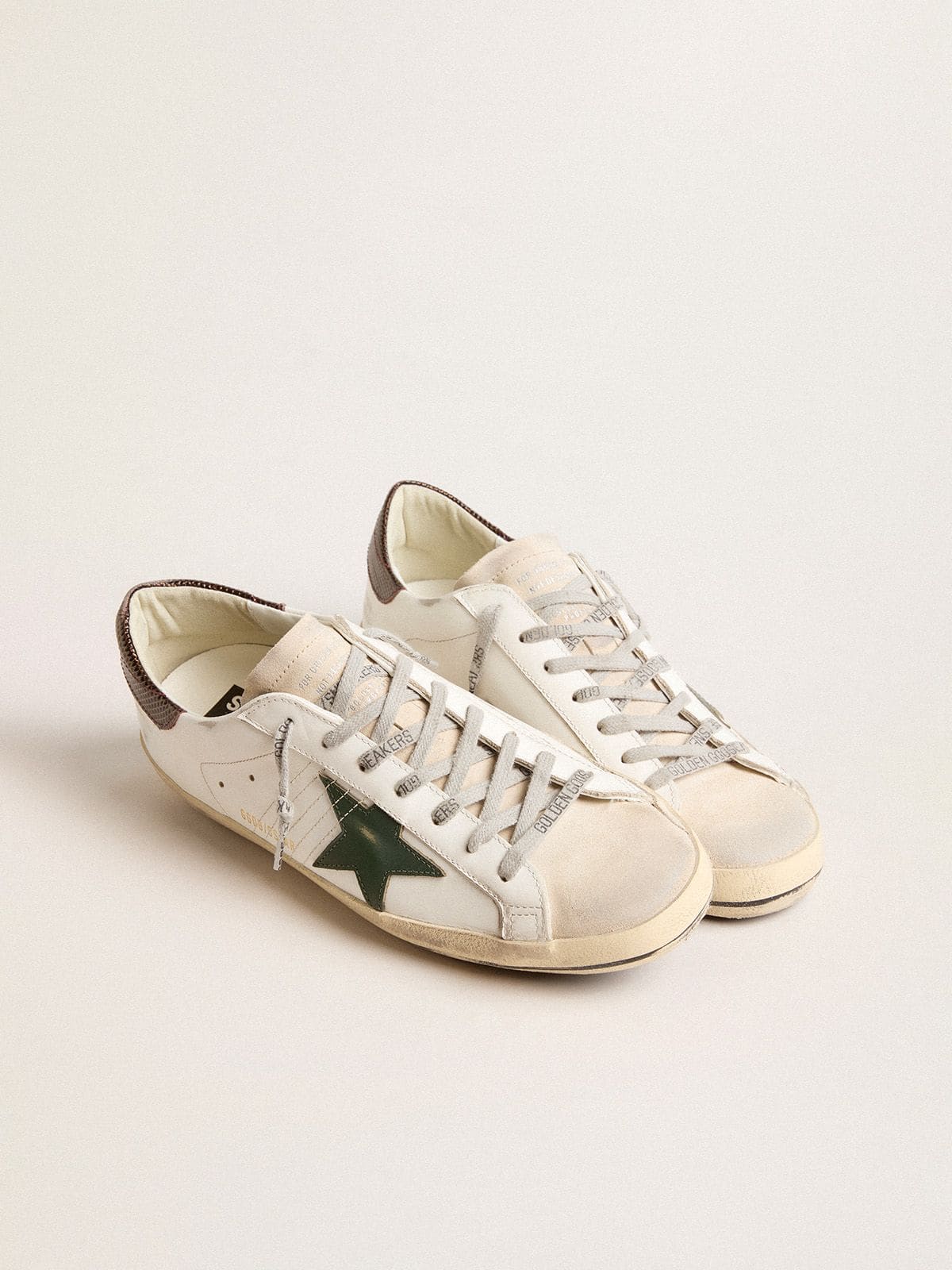 Men’s Super-Star in white leather with green star and animal-print heel tab
