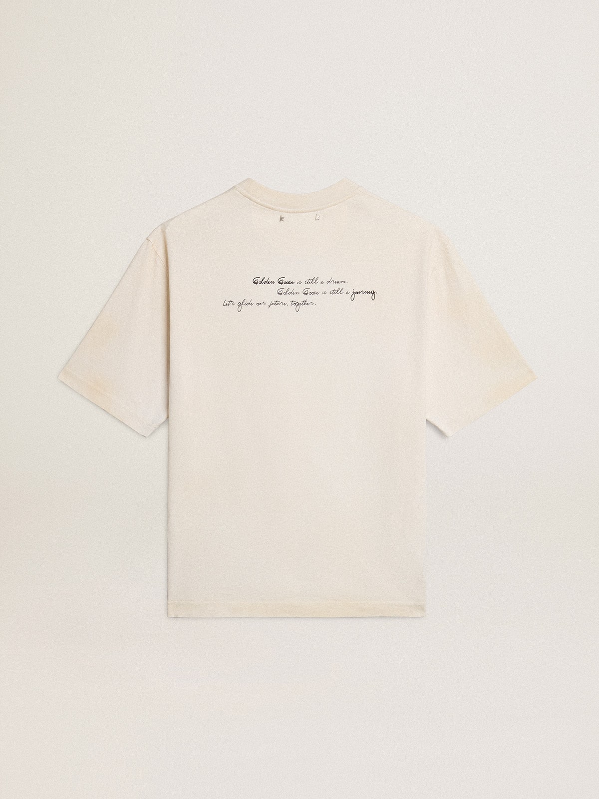 Worn-white unisex T-shirt with printed lettering
