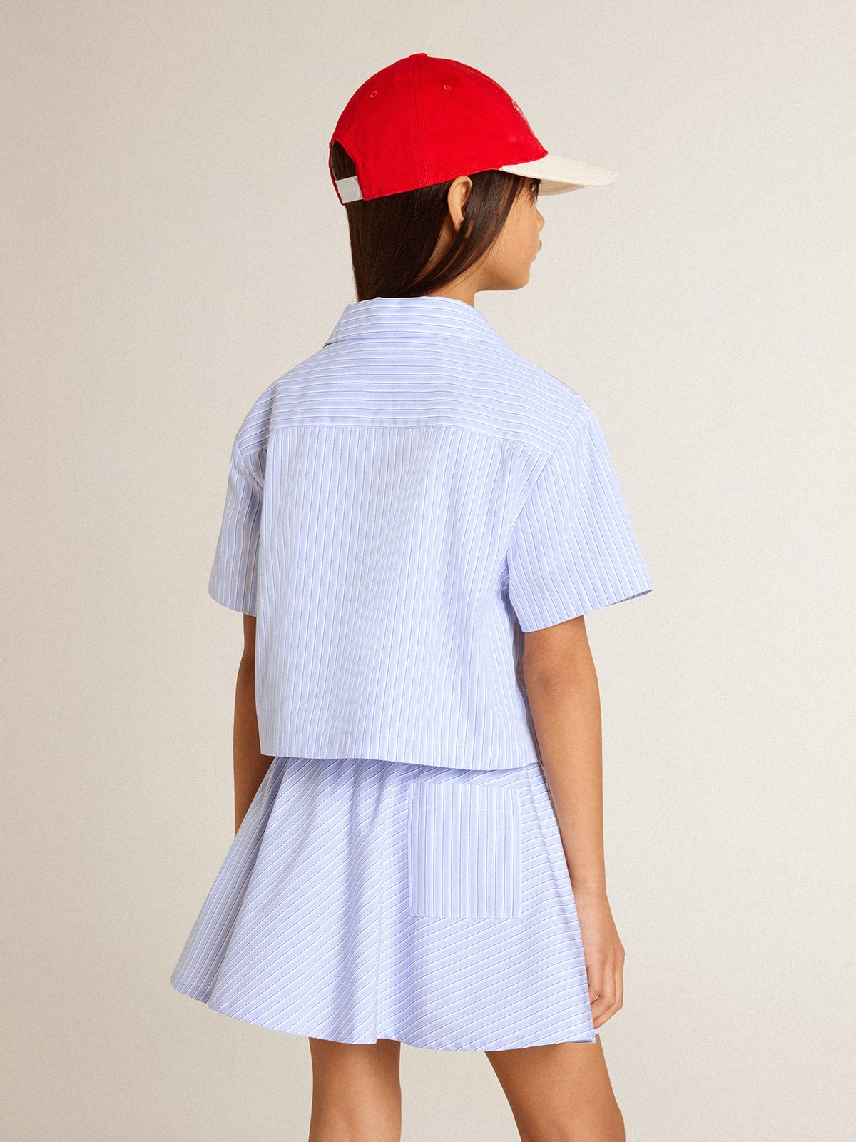 Girls' cropped shirt in striped light blue cotton