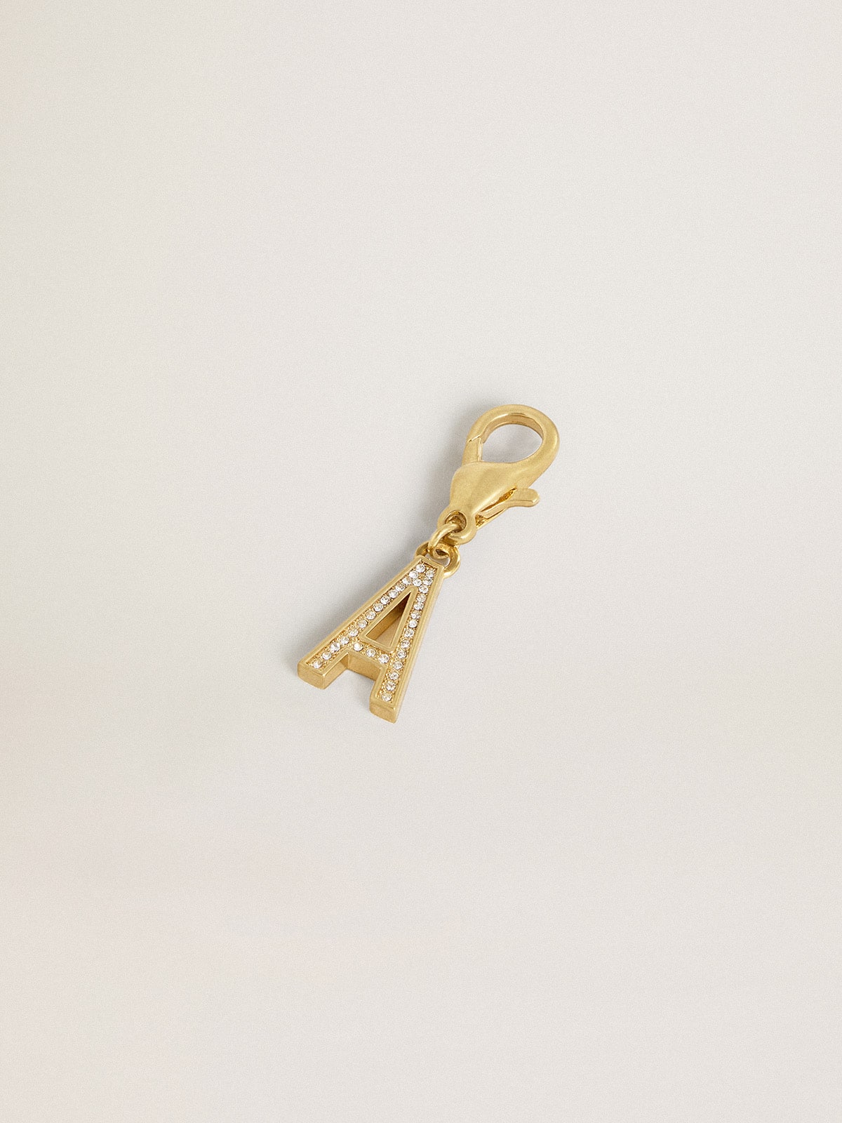Letter A charm in gold-colored brass with crystals