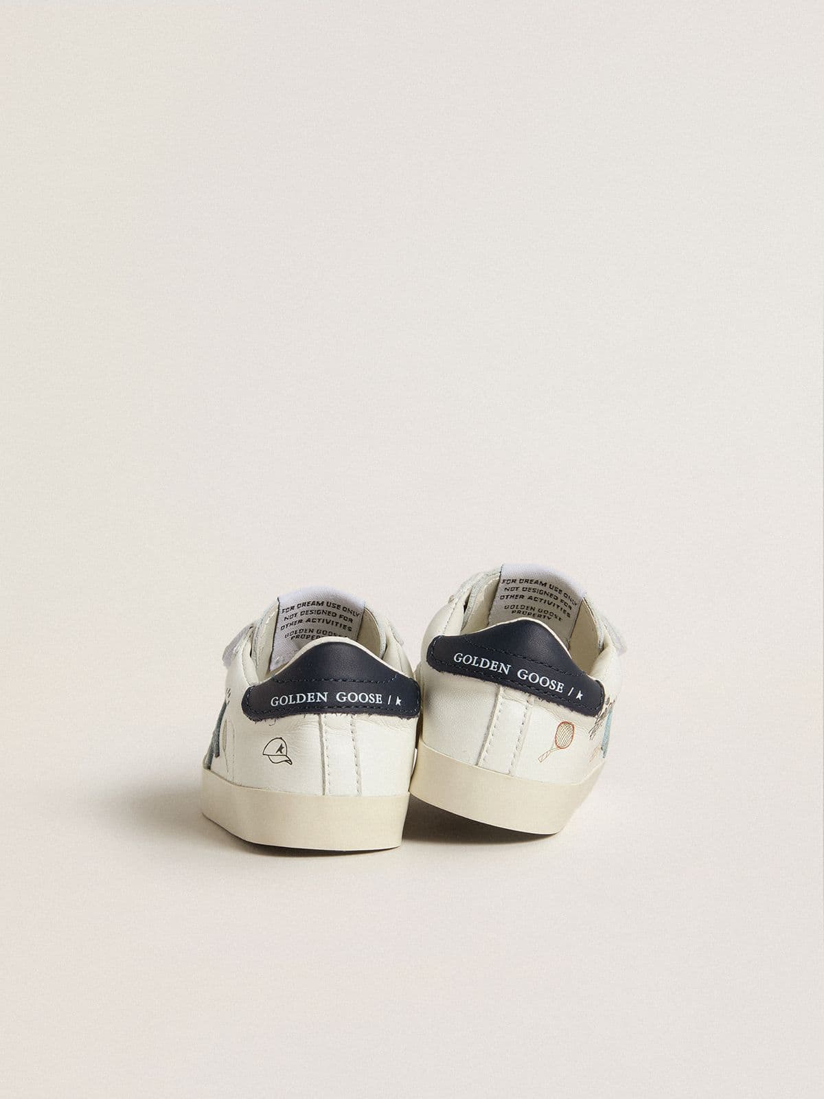 Baby School in white nappa with light blue suede star and tennis motif