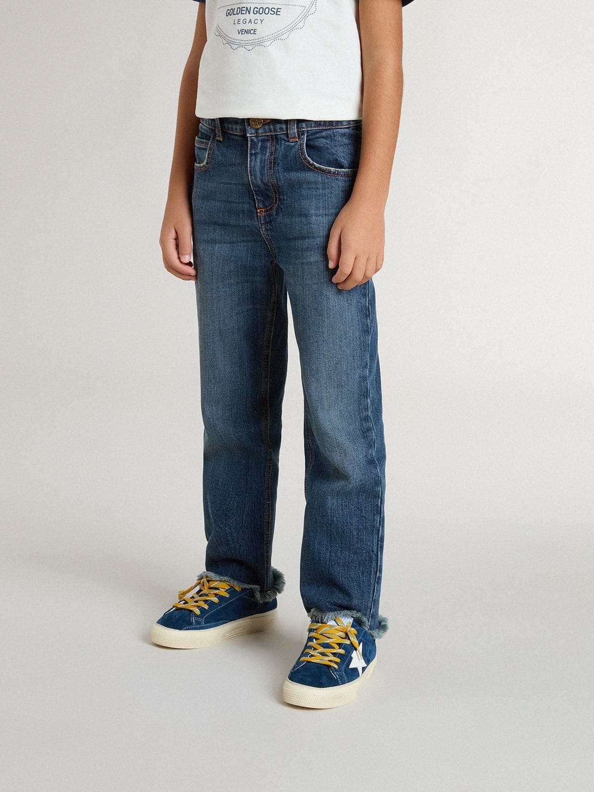 Boys' denim jeans with a raw edge and embroidery