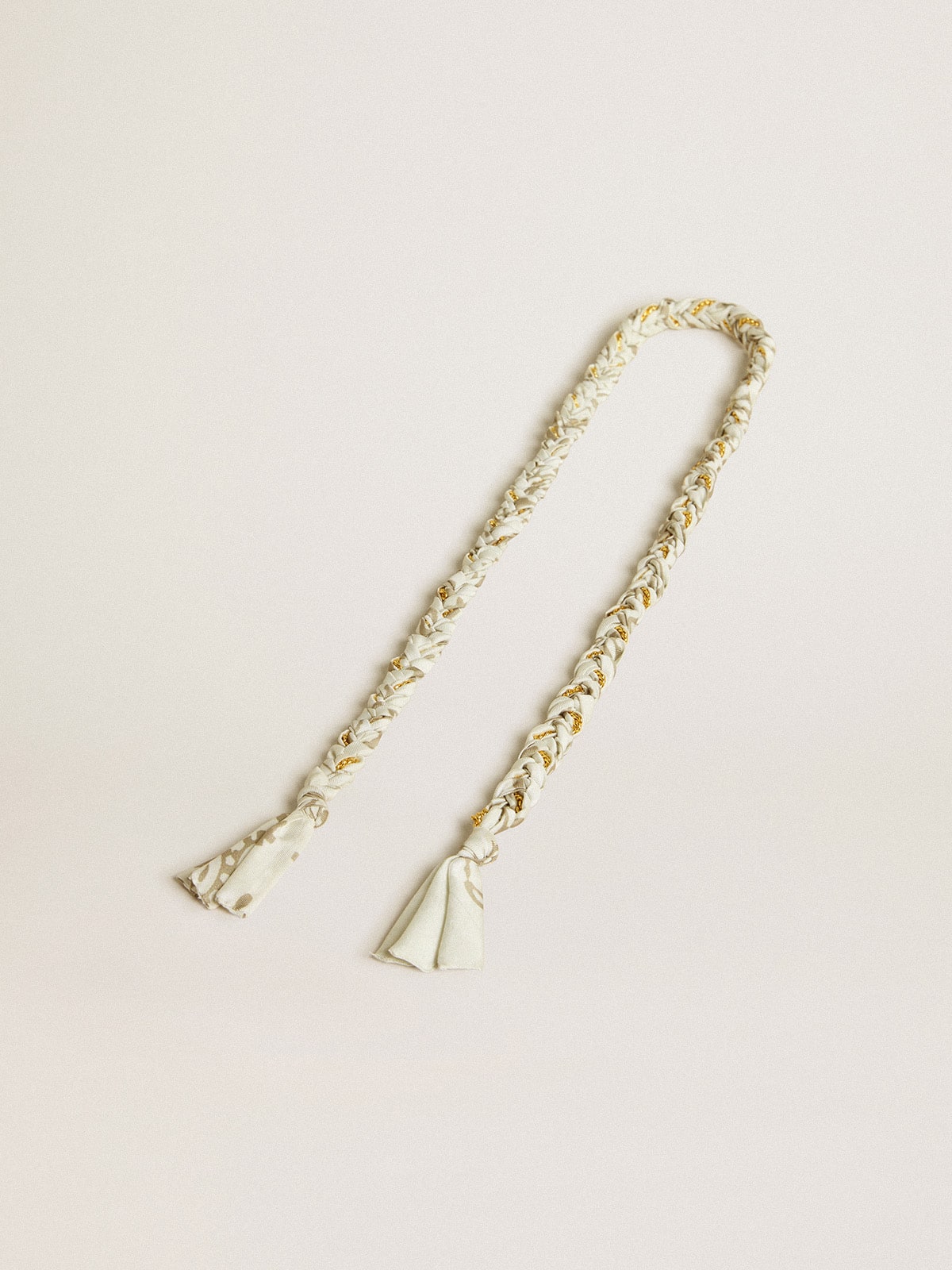 Butter-colored braided fabric charm with brass chain
