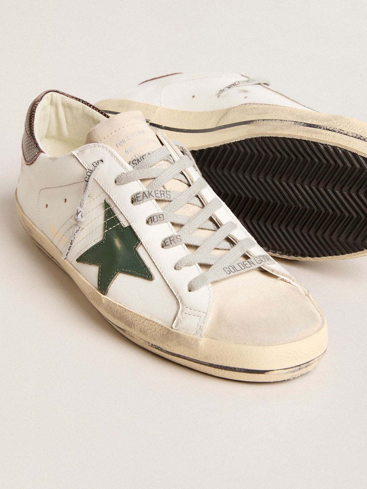 Men’s Super-Star in white leather with green star and animal-print heel tab