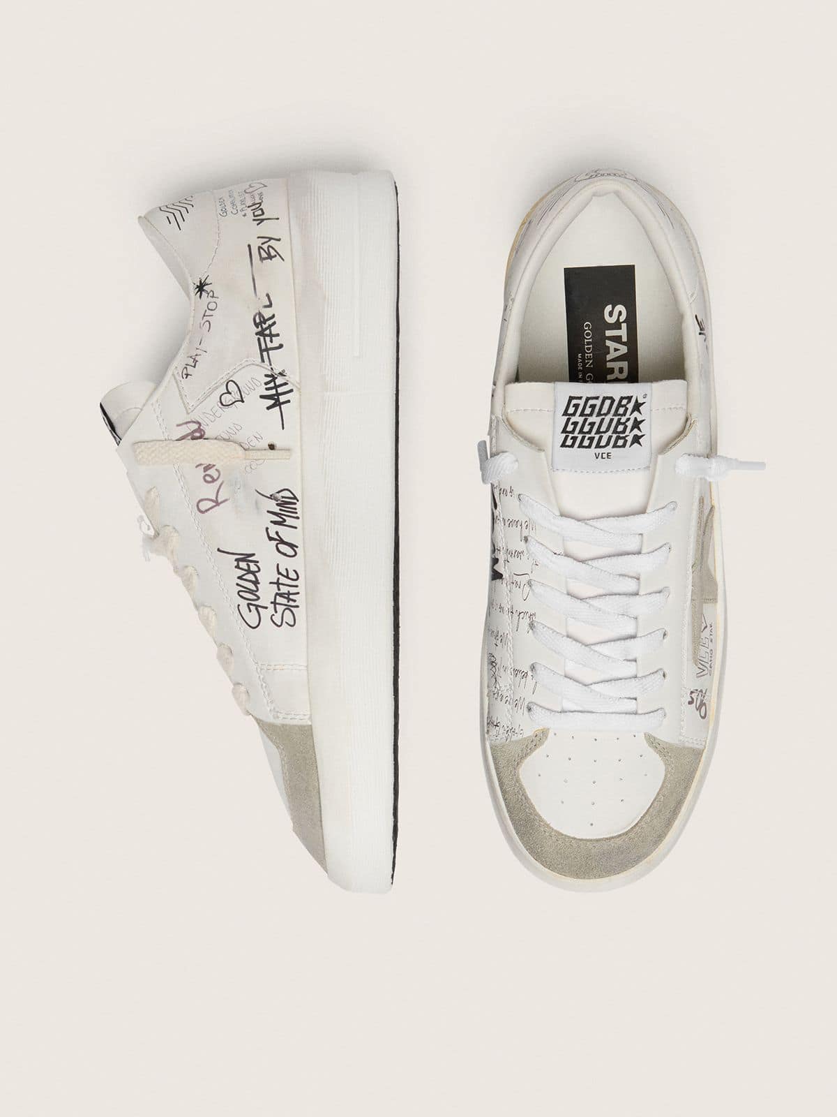 Stardan with beige suede star and toe and all-over lettering and patterns