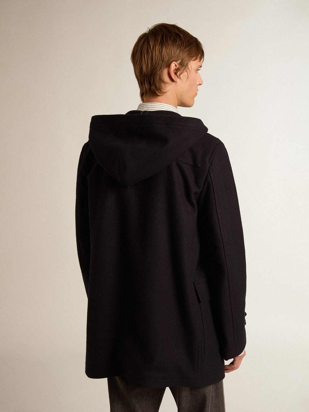 Dark blue wool duffle coat with hood and toggle fastening