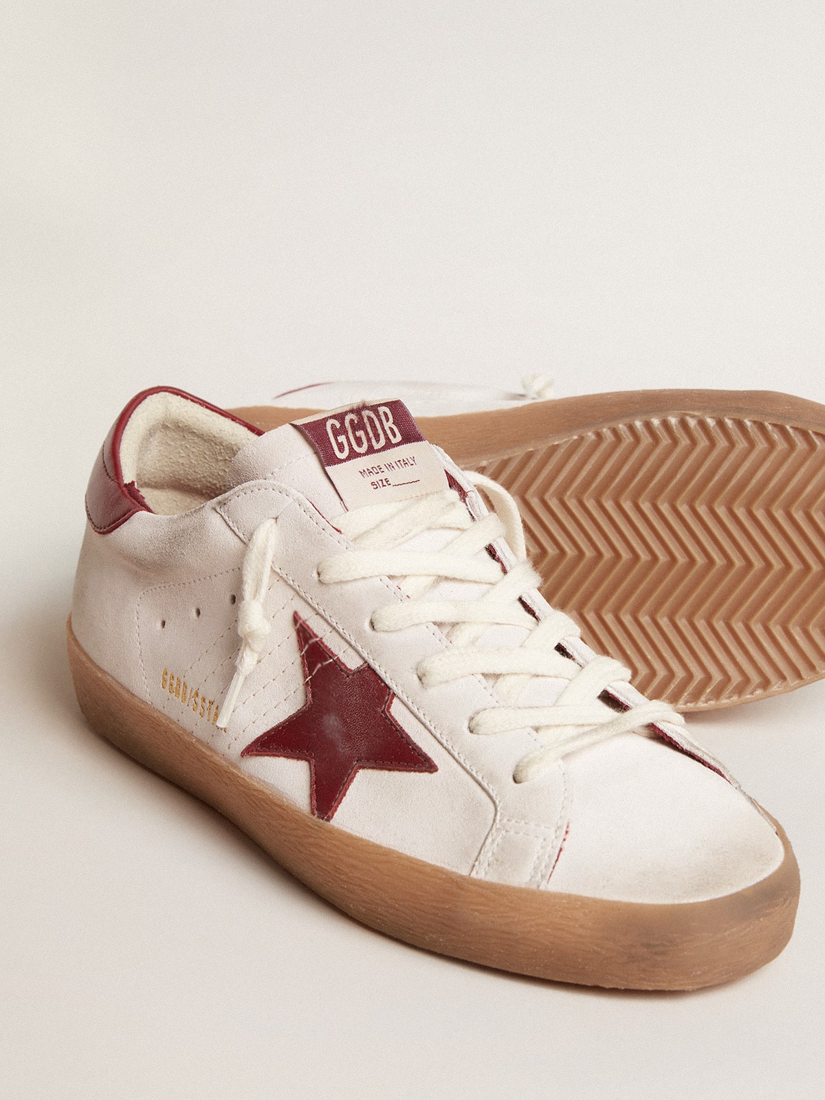 Super-Star in white suede with burgundy leather star and heel tab