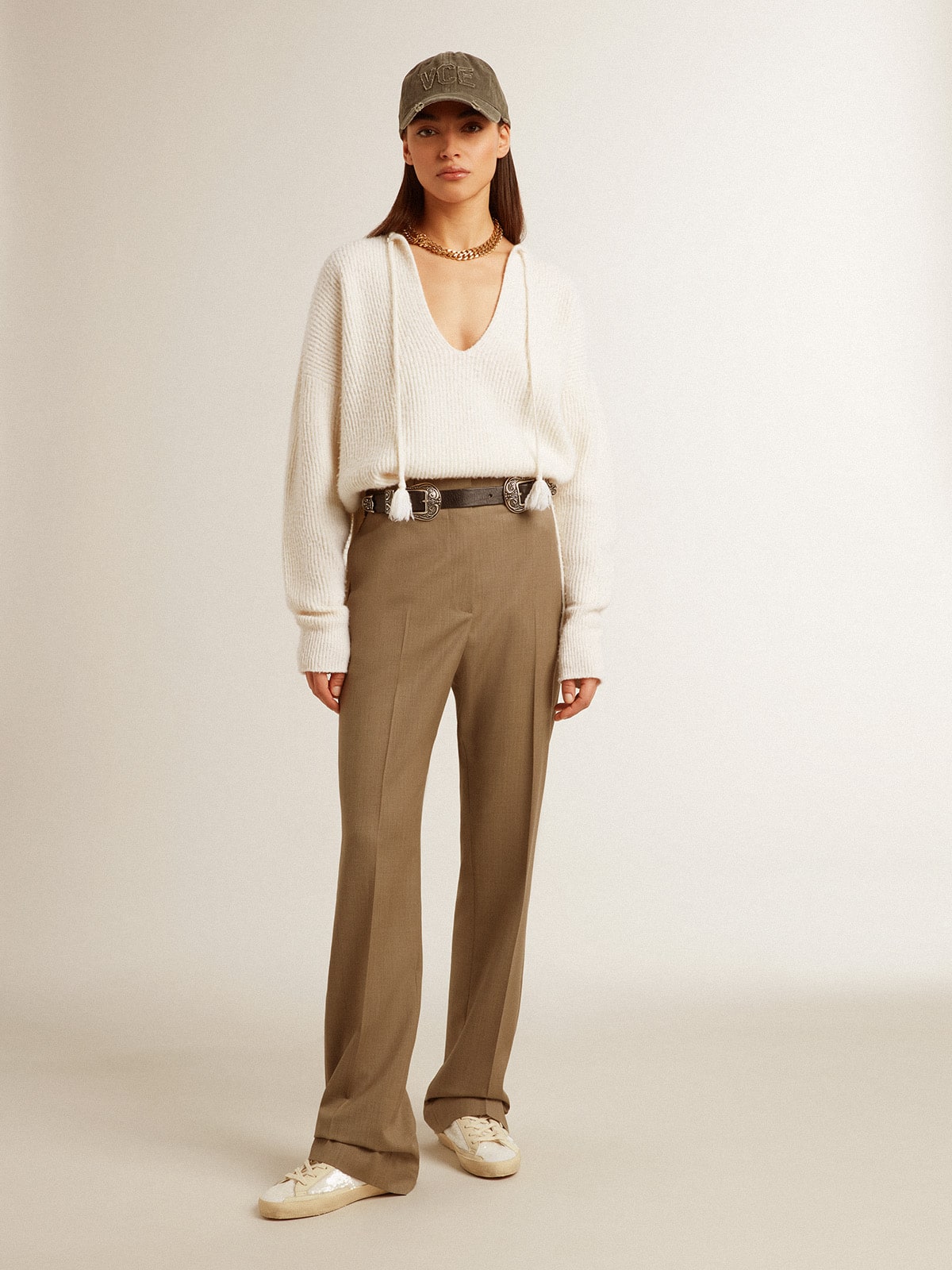 Ribbed wool sweater with V neck and drawstring with tassels