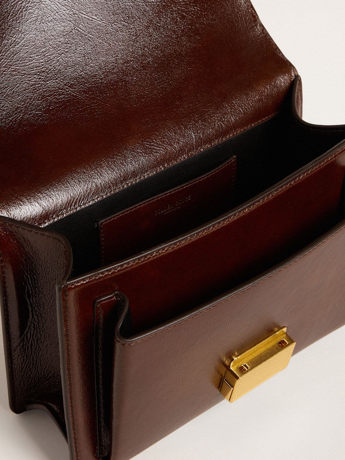 Venezia Bag in dark brown laminated leather with gold details