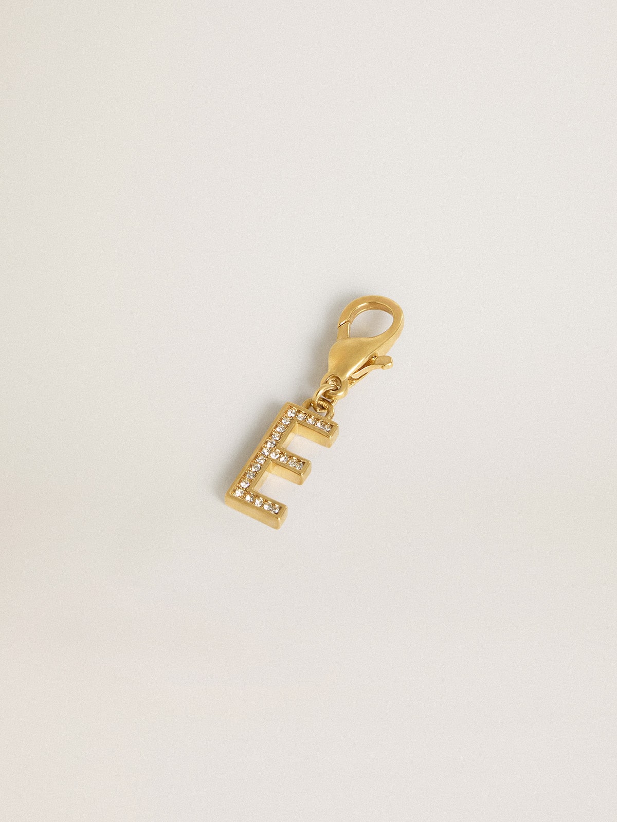 Letter E charm in gold-colored brass with crystals