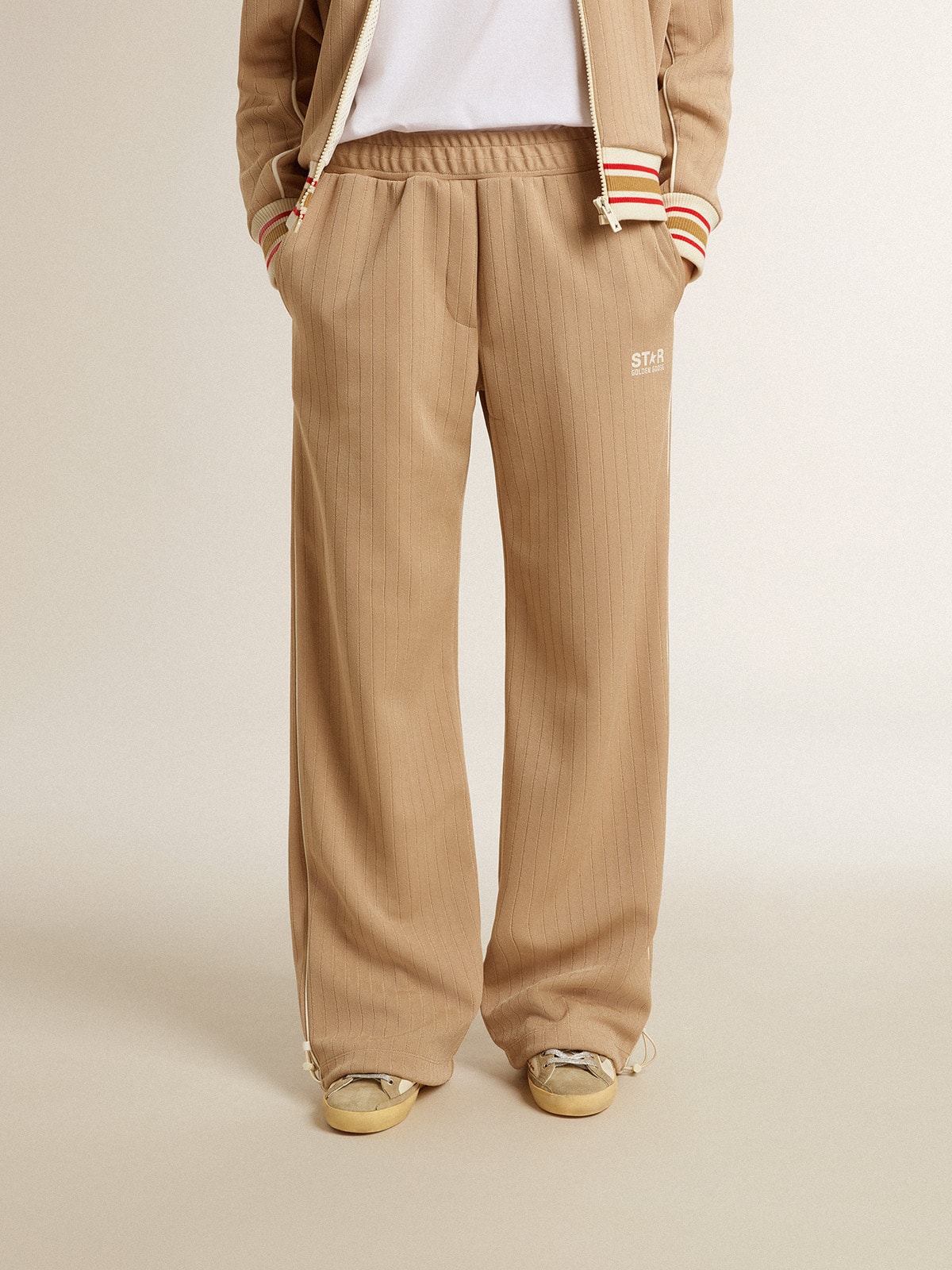 Women’s light beige joggers with white logo