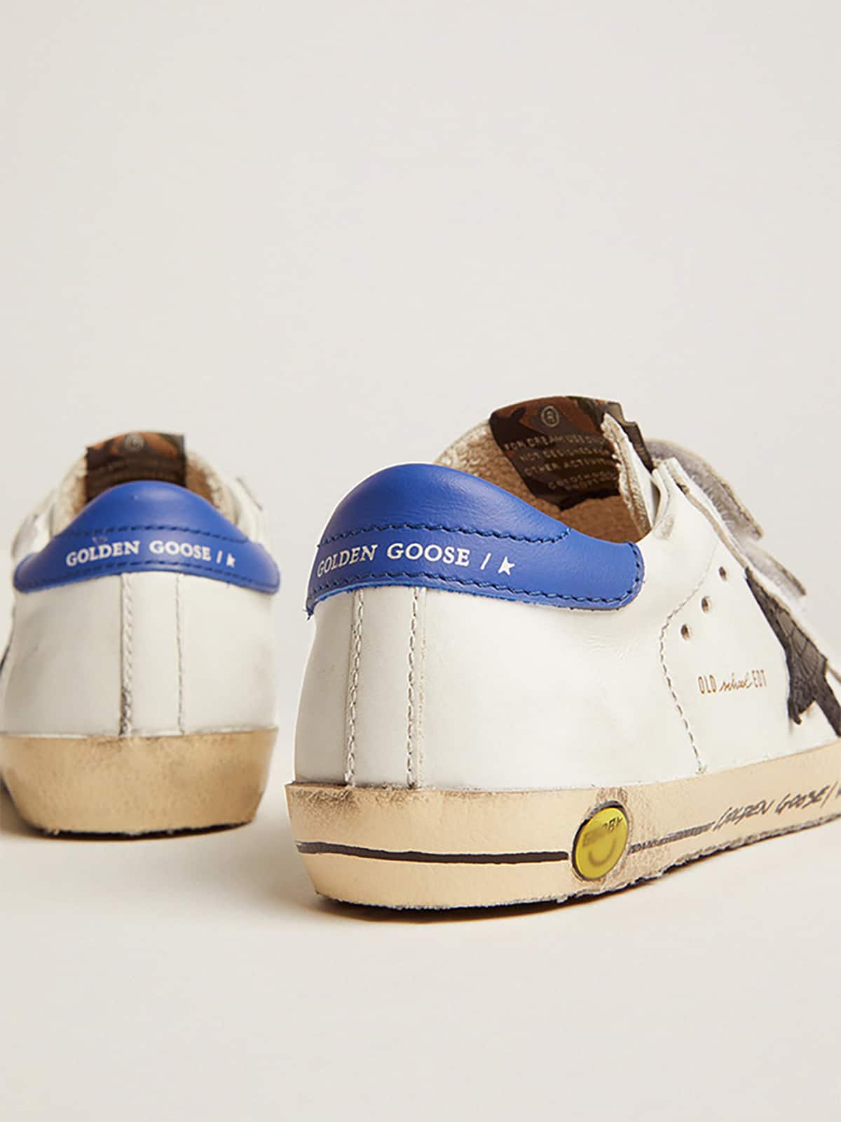 Young Old School with black snake print leather star and blue heel