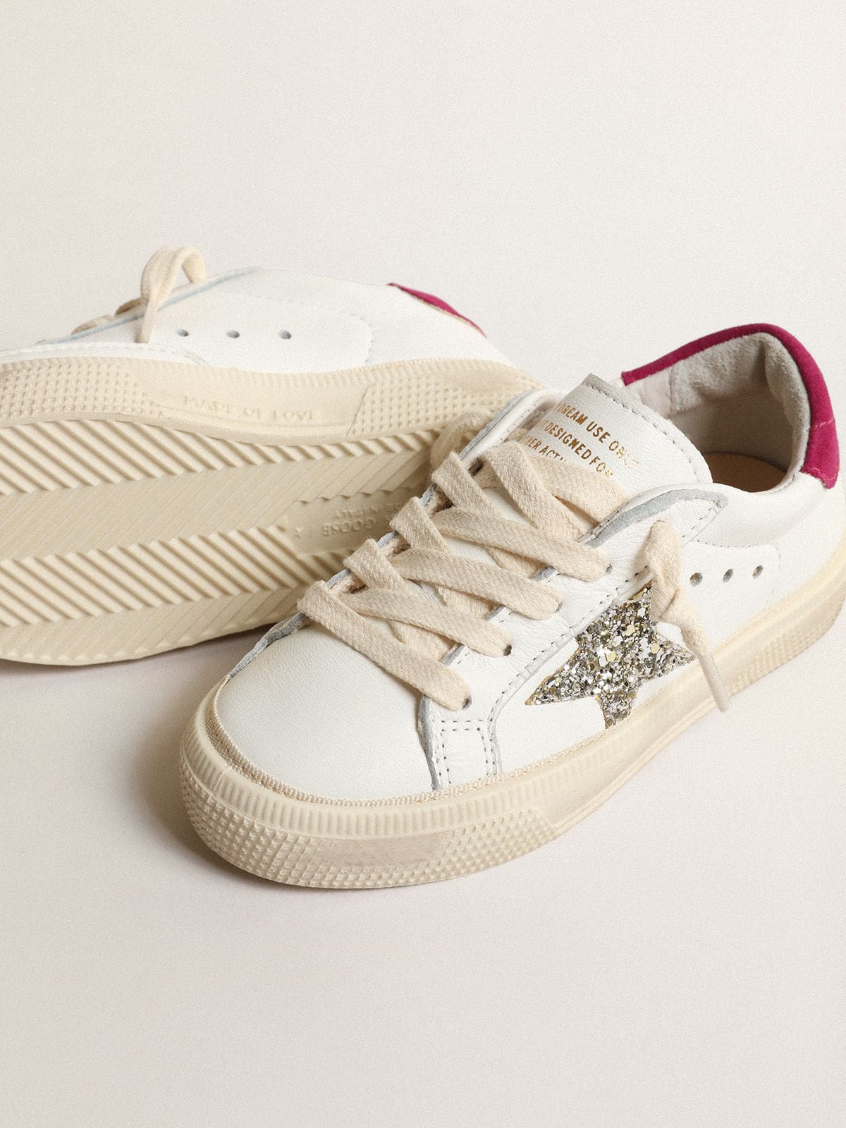 May Young in nappa leather with platinum glitter star and magenta heel tab