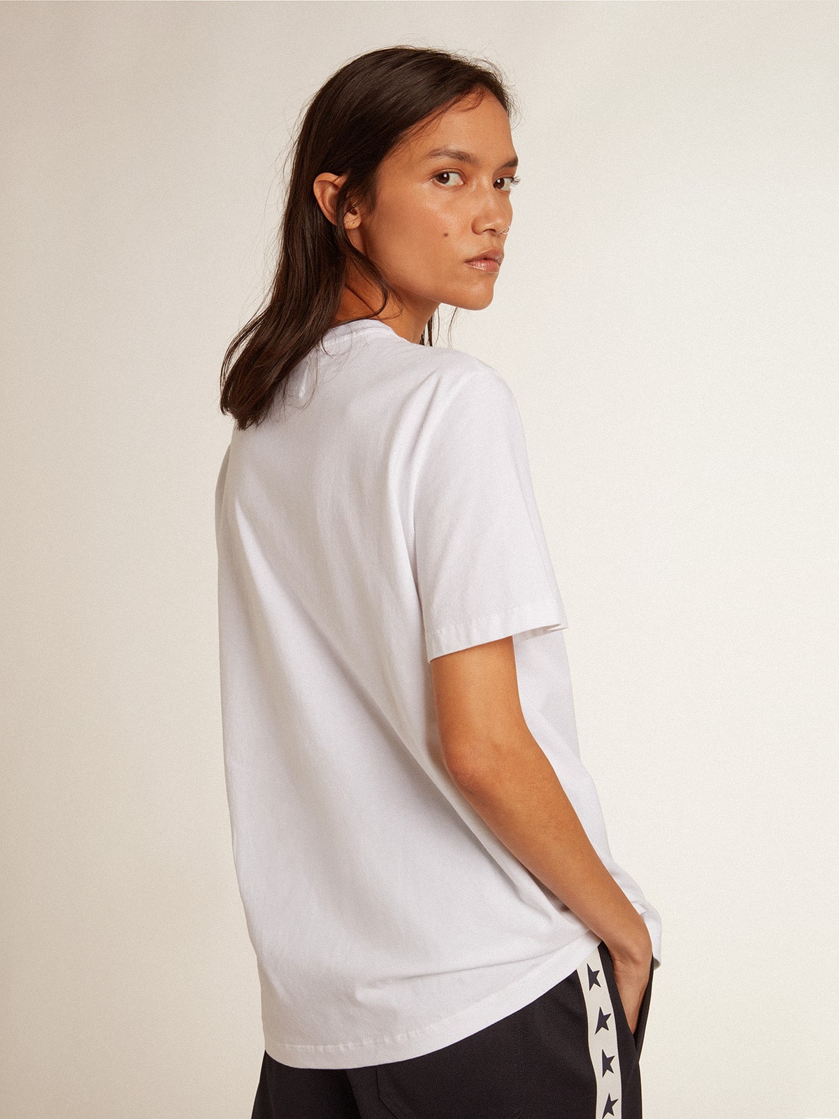 Women’s white T-shirt with dark blue star on the front