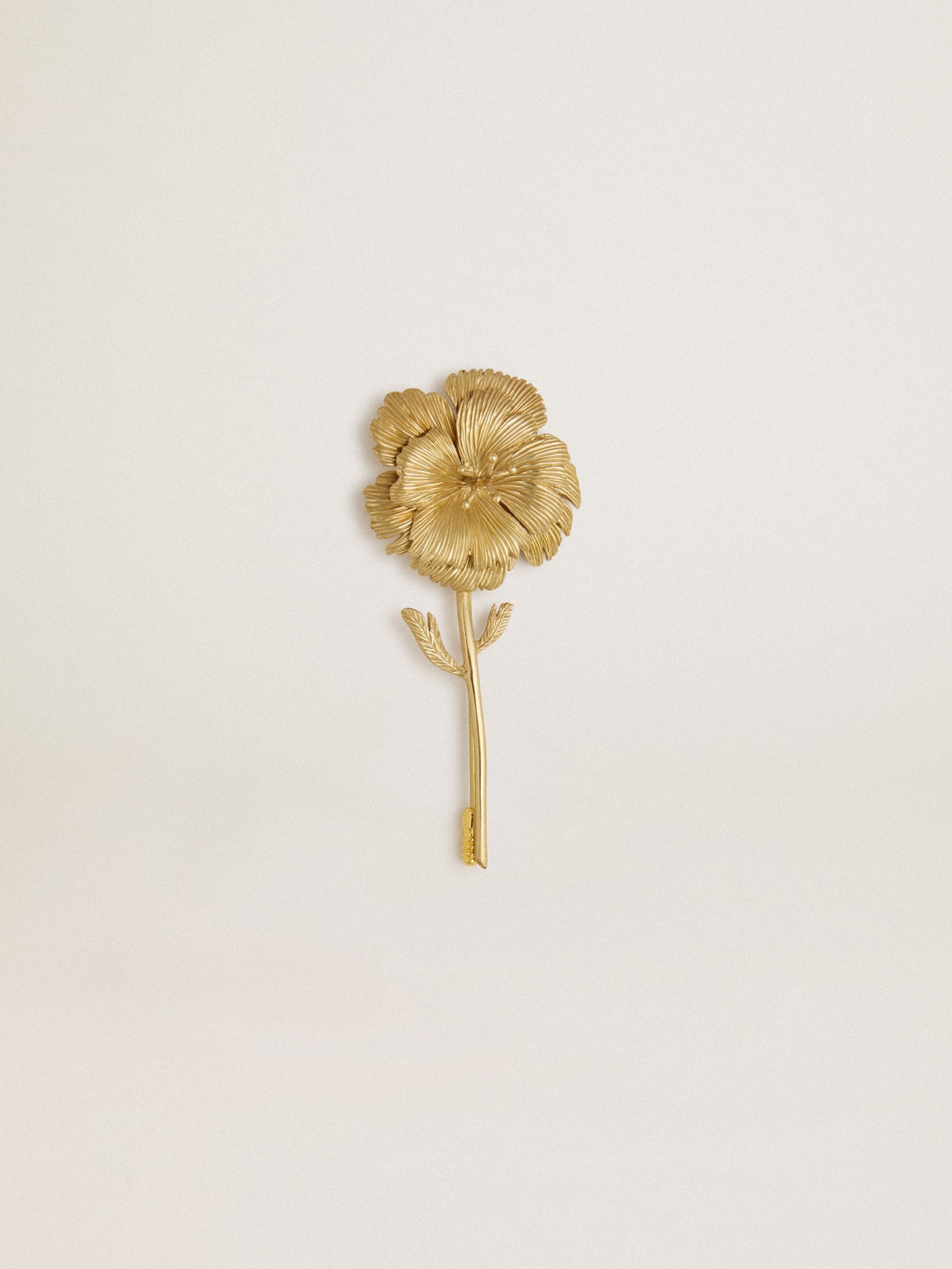Gold pin with floral design
