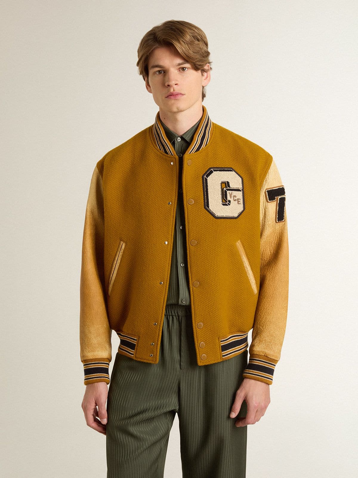 Ochre yellow wool bomber jacket with leather sleeves