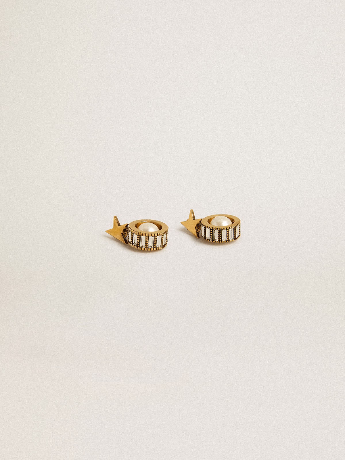 Earrings with gold star and pearl