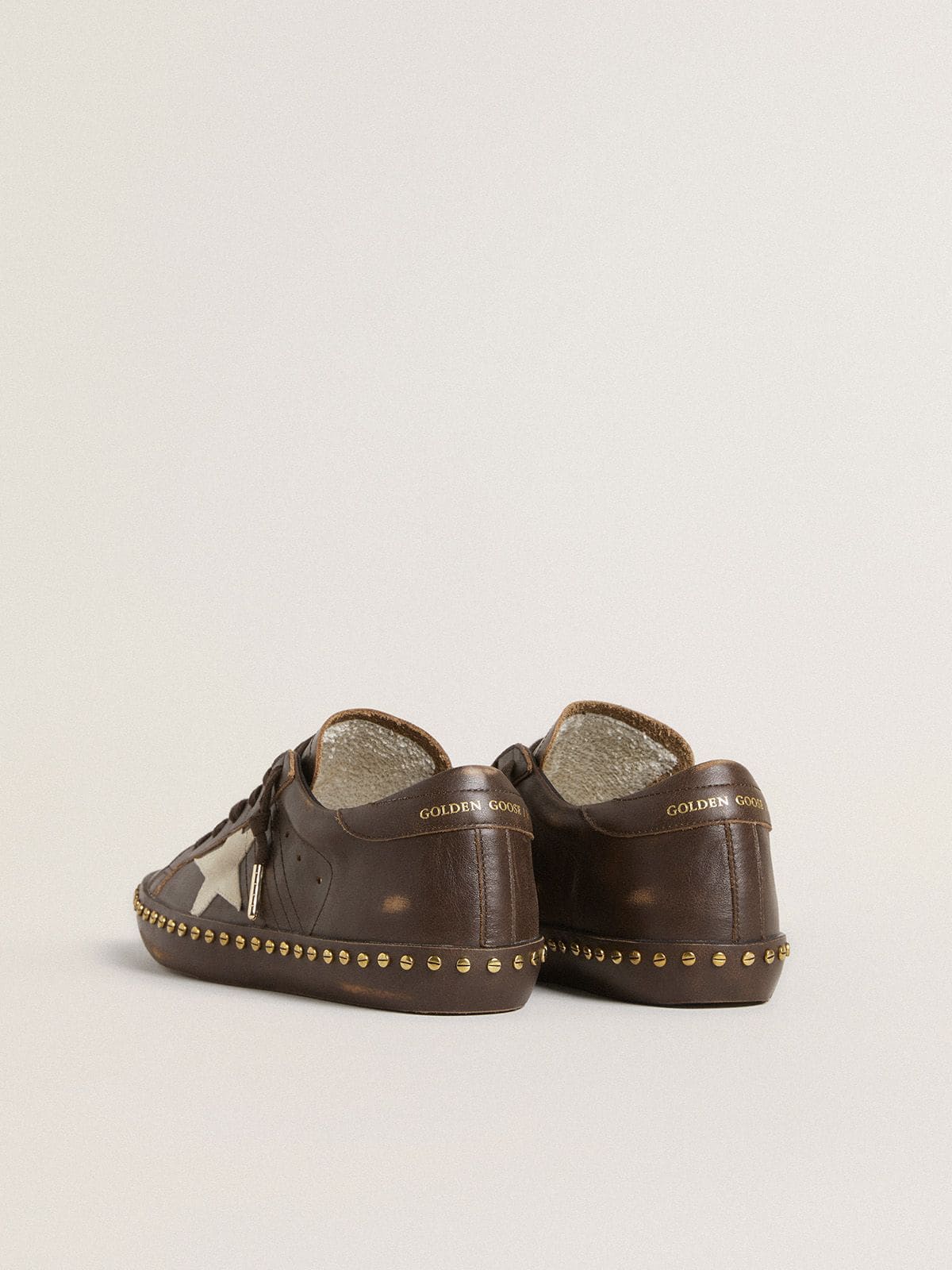 Women’s Super-Star in dark brown leather with cream suede star and studs