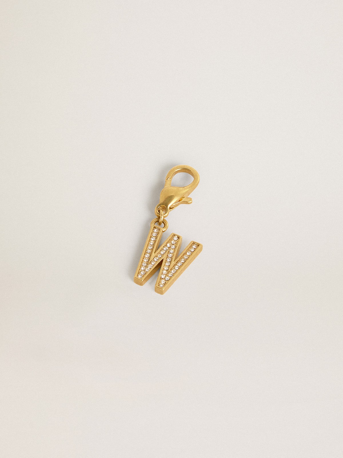 Letter W charm in gold-colored brass with crystals