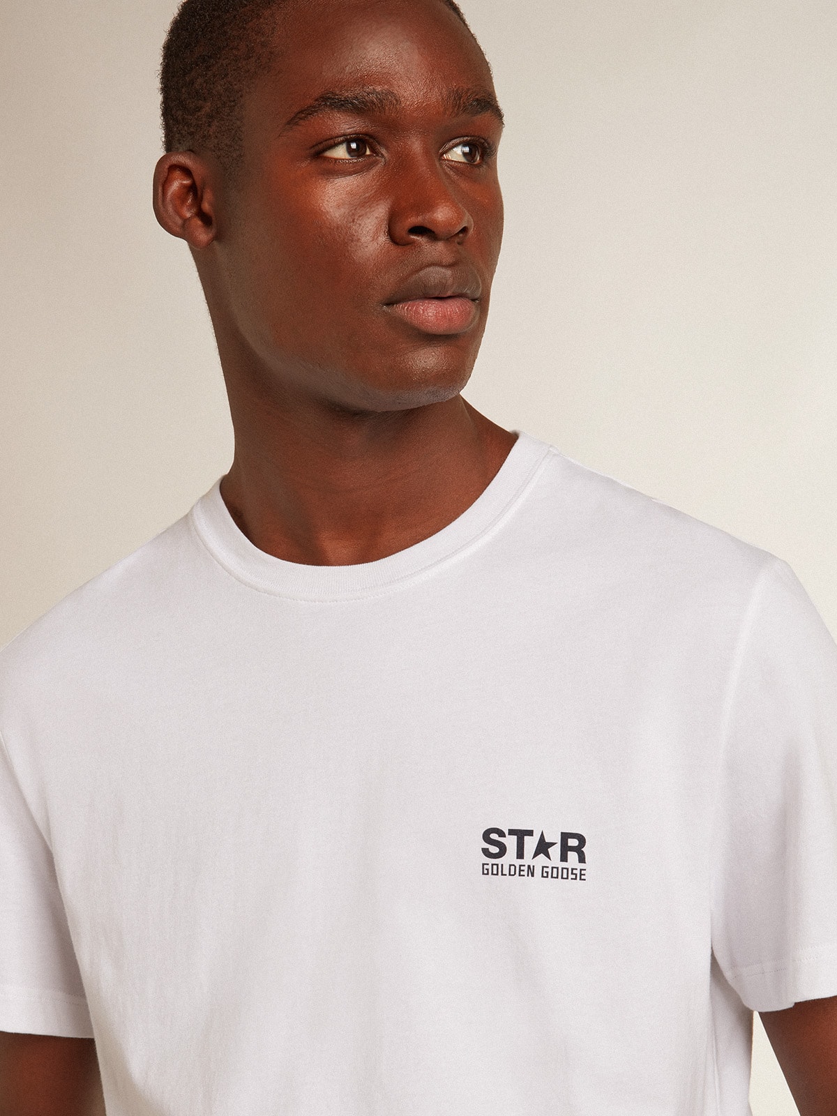 Men’s white T-shirt with dark blue star on the back