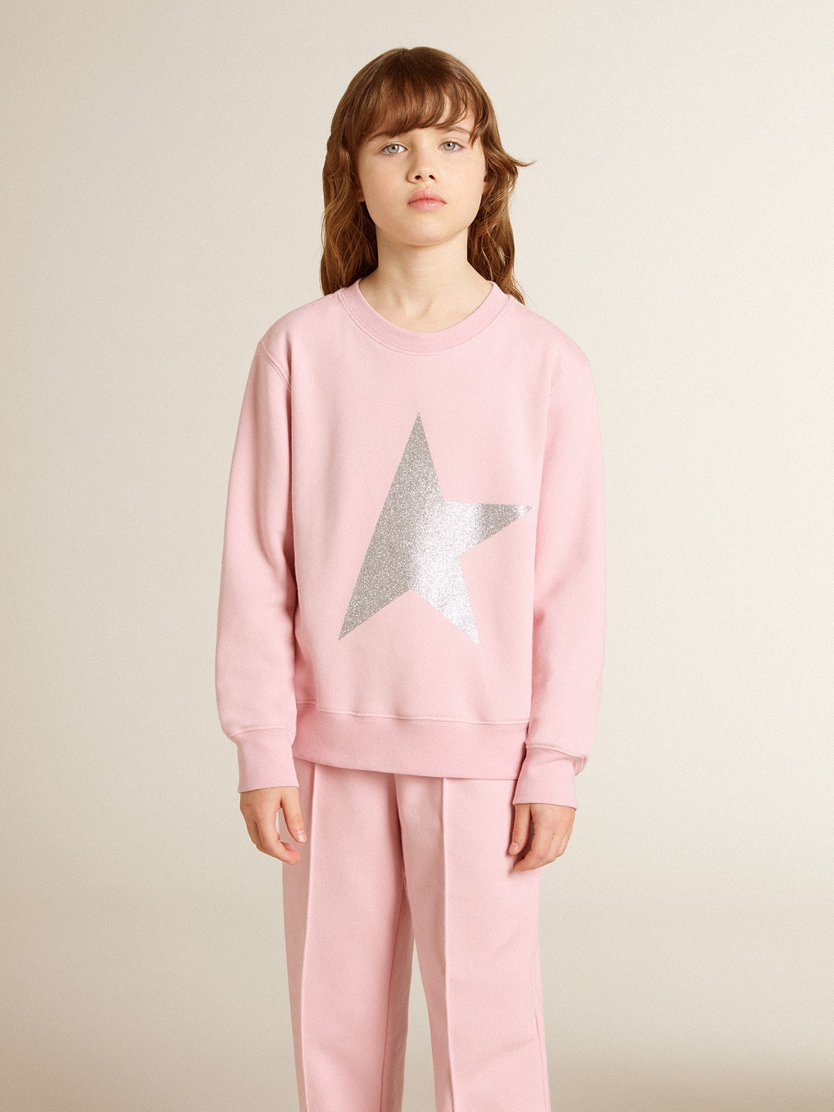 Pink sweatshirt with maxi star in silver glitter on the front