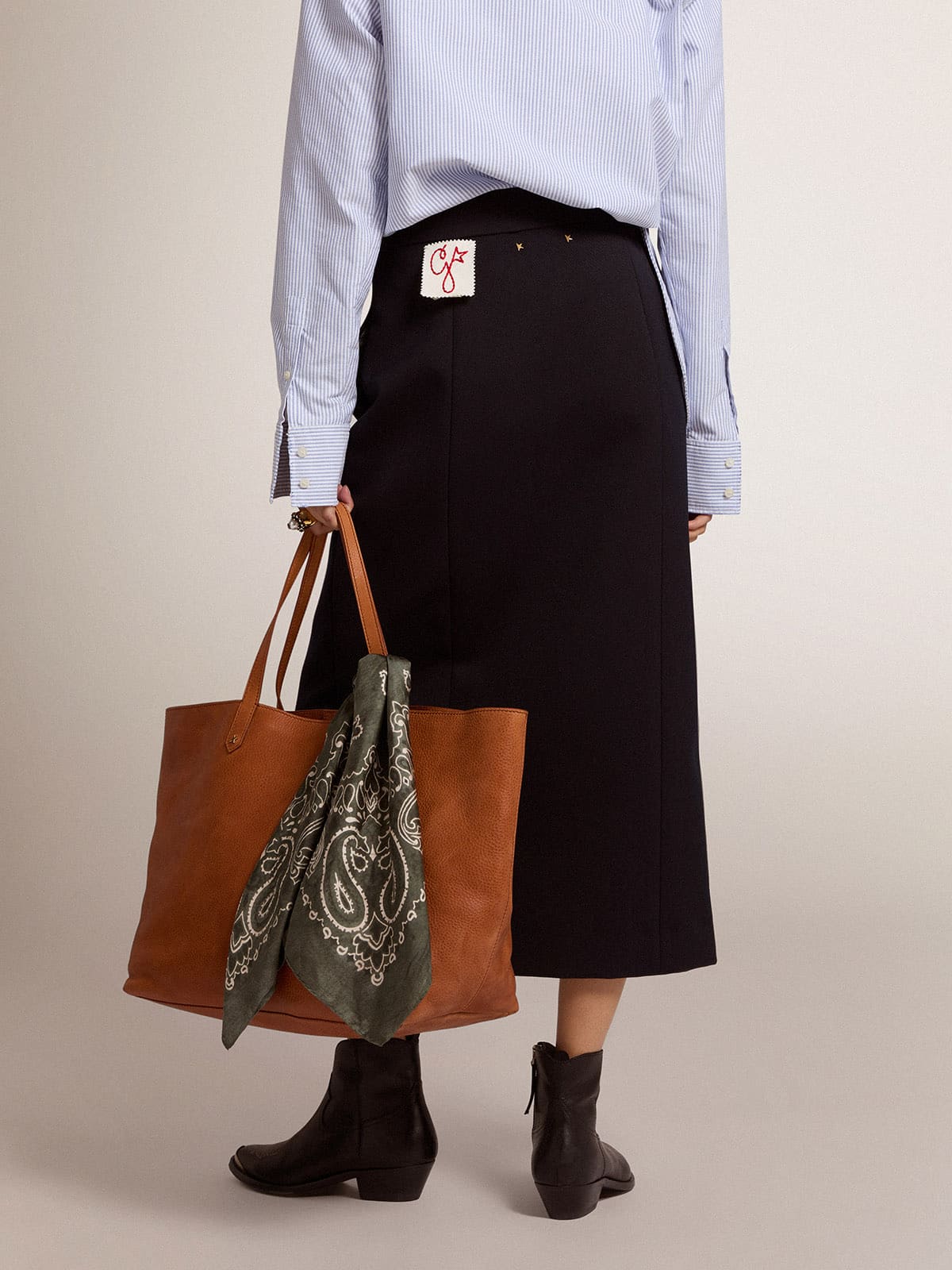 Women's pencil skirt in dark blue wool with gold heraldic buttons