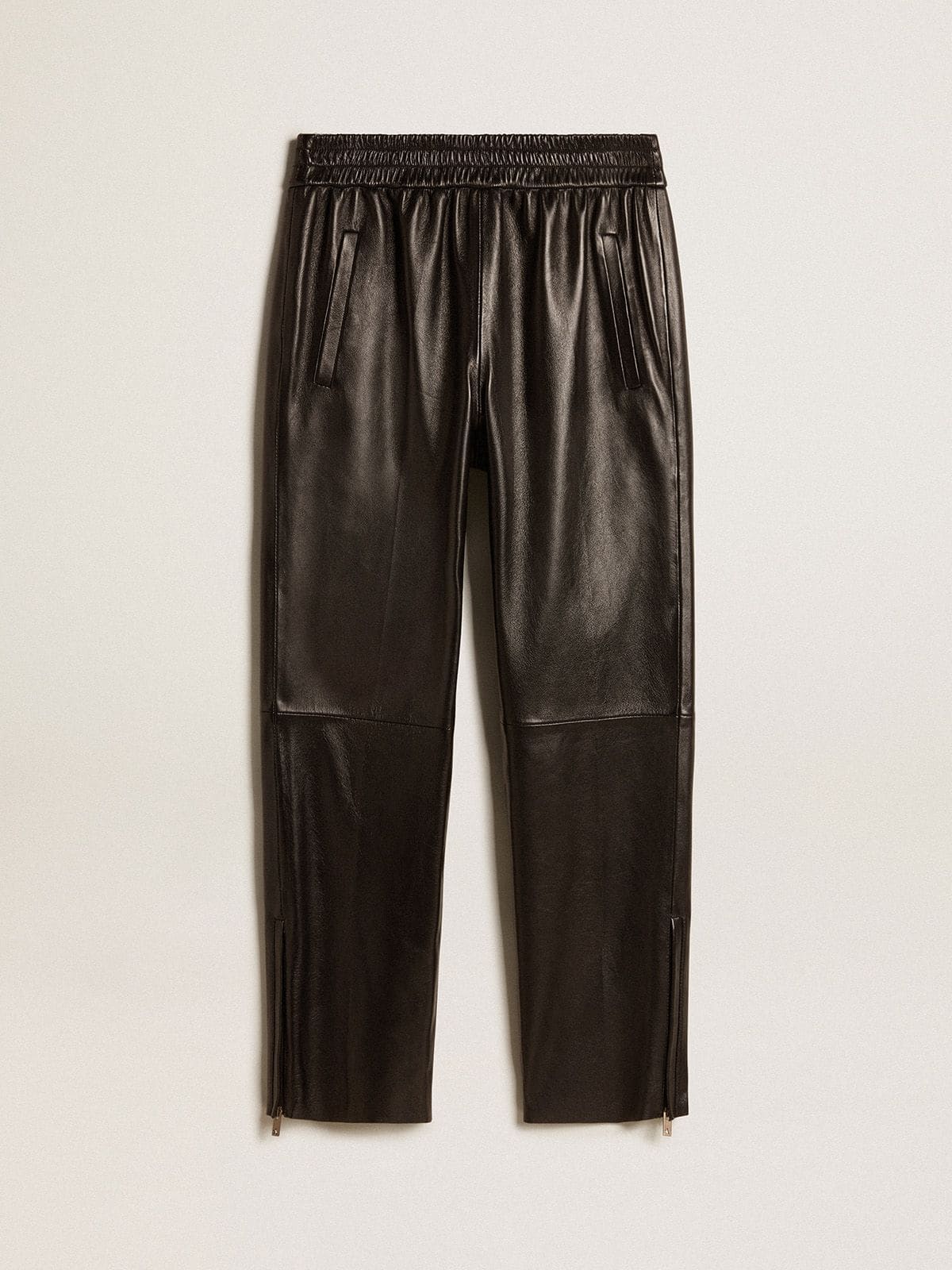Black joggers in nappa leather with zip at the base