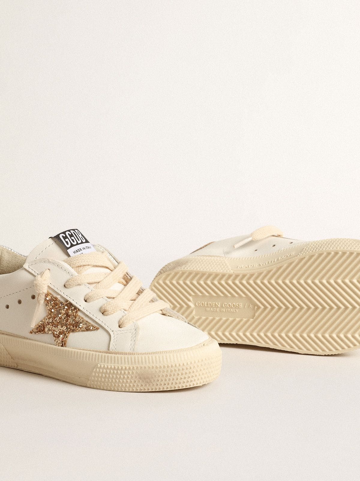 May Teen in white leather with gold glitter star and silver heel tab