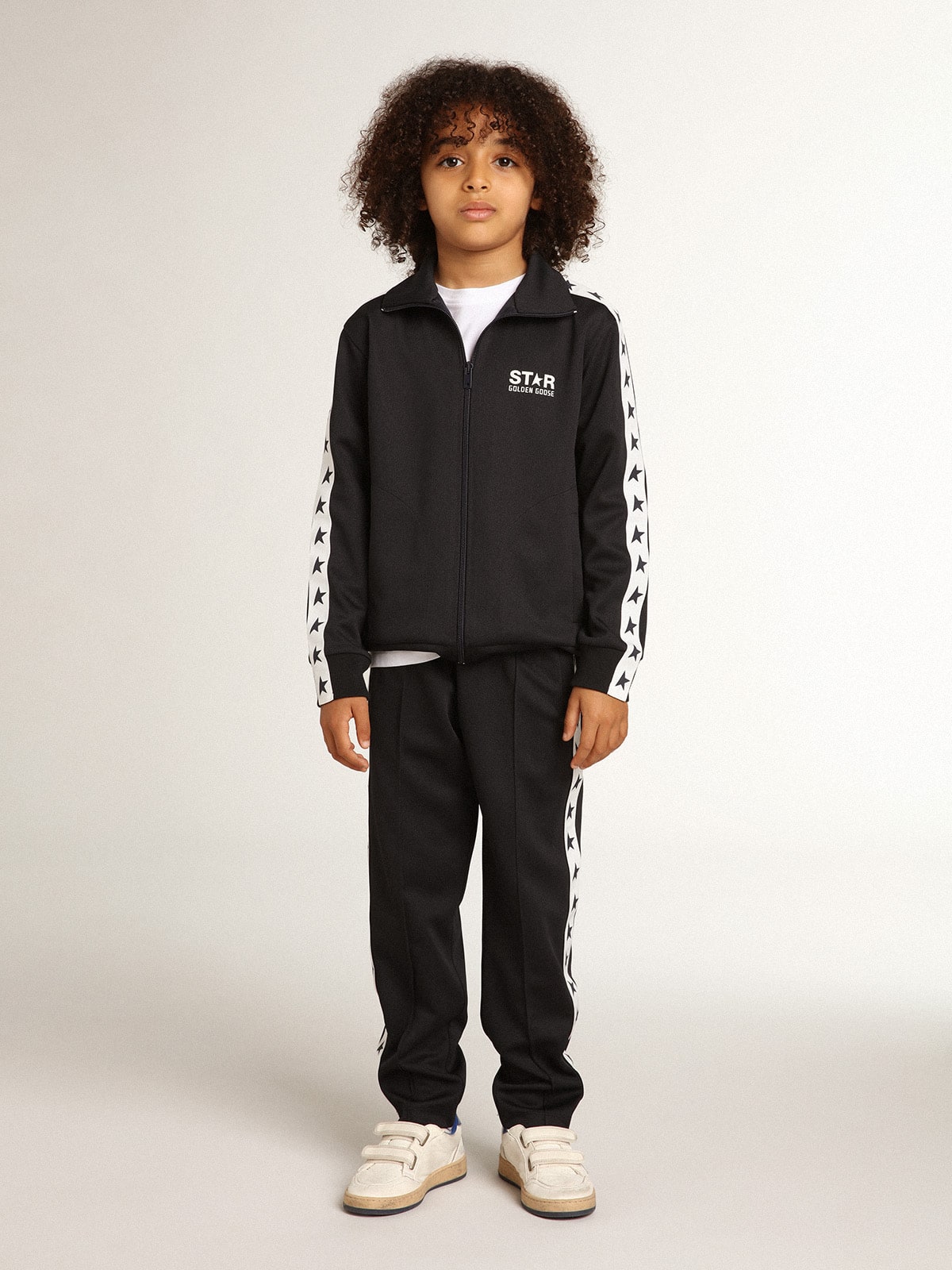 Dark blue joggers with white strip and contrasting stars