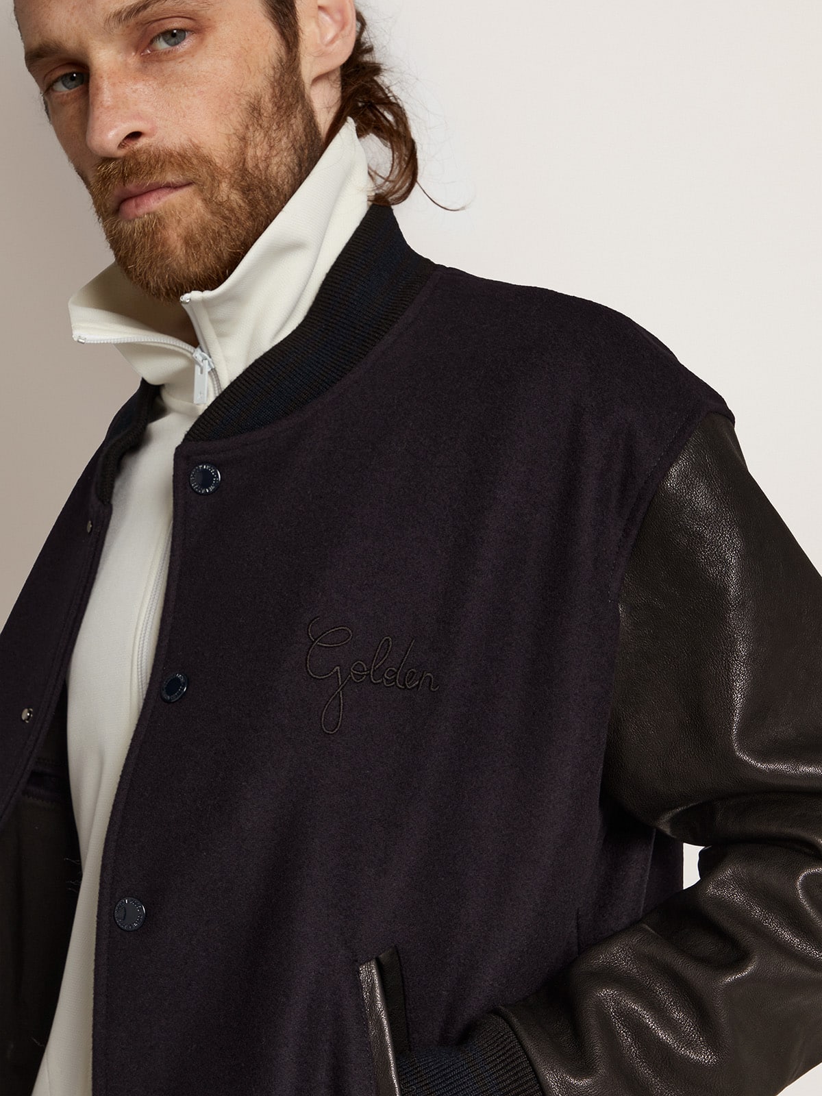 Men's bomber jacket in dark blue wool with leather sleeves