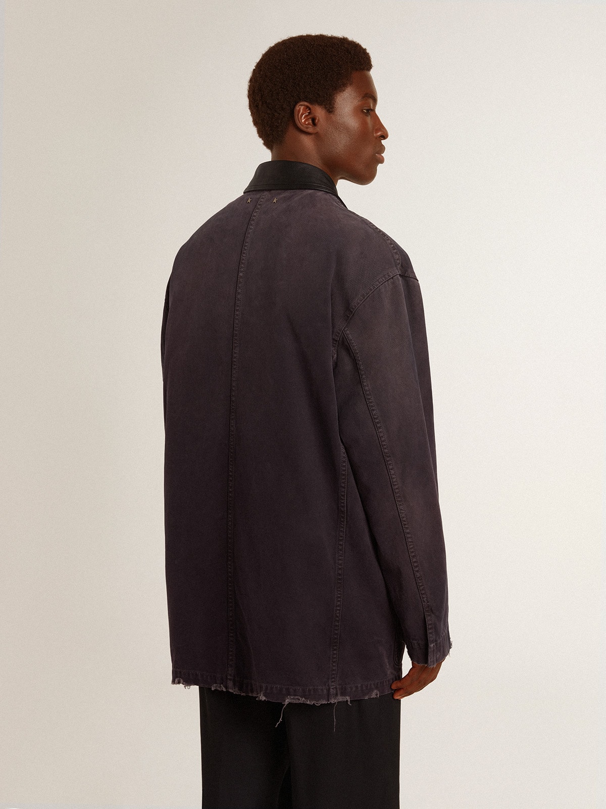 Men's denim jacket with distressed details and leather collar