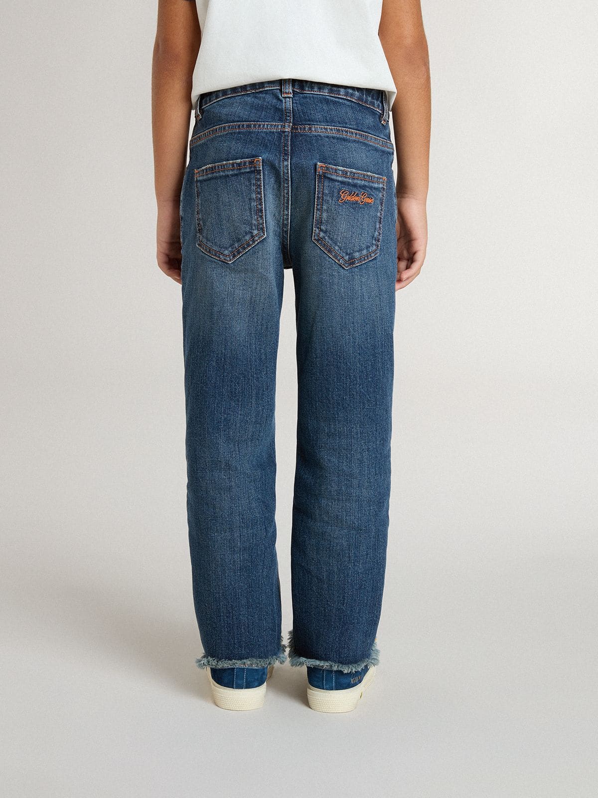 Boys' denim jeans with a raw edge and embroidery