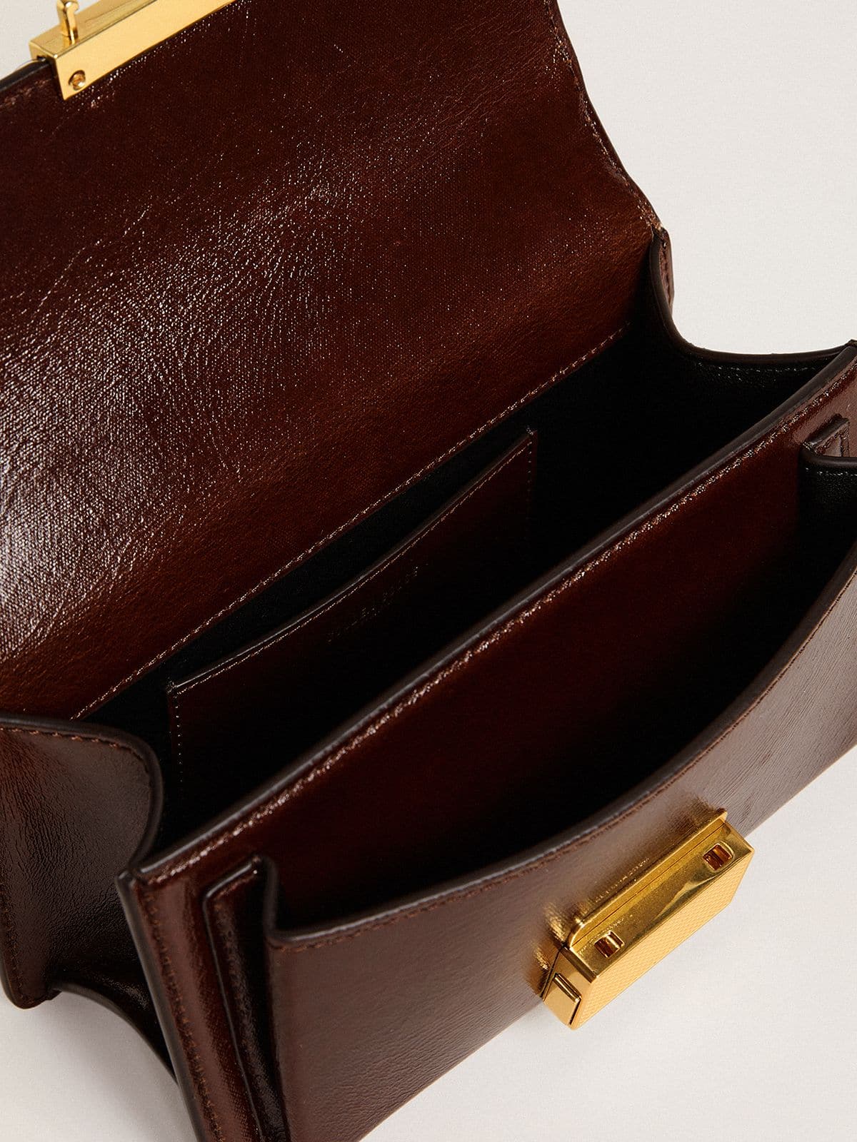 Small Venezia Bag in dark brown laminated leather with gold details