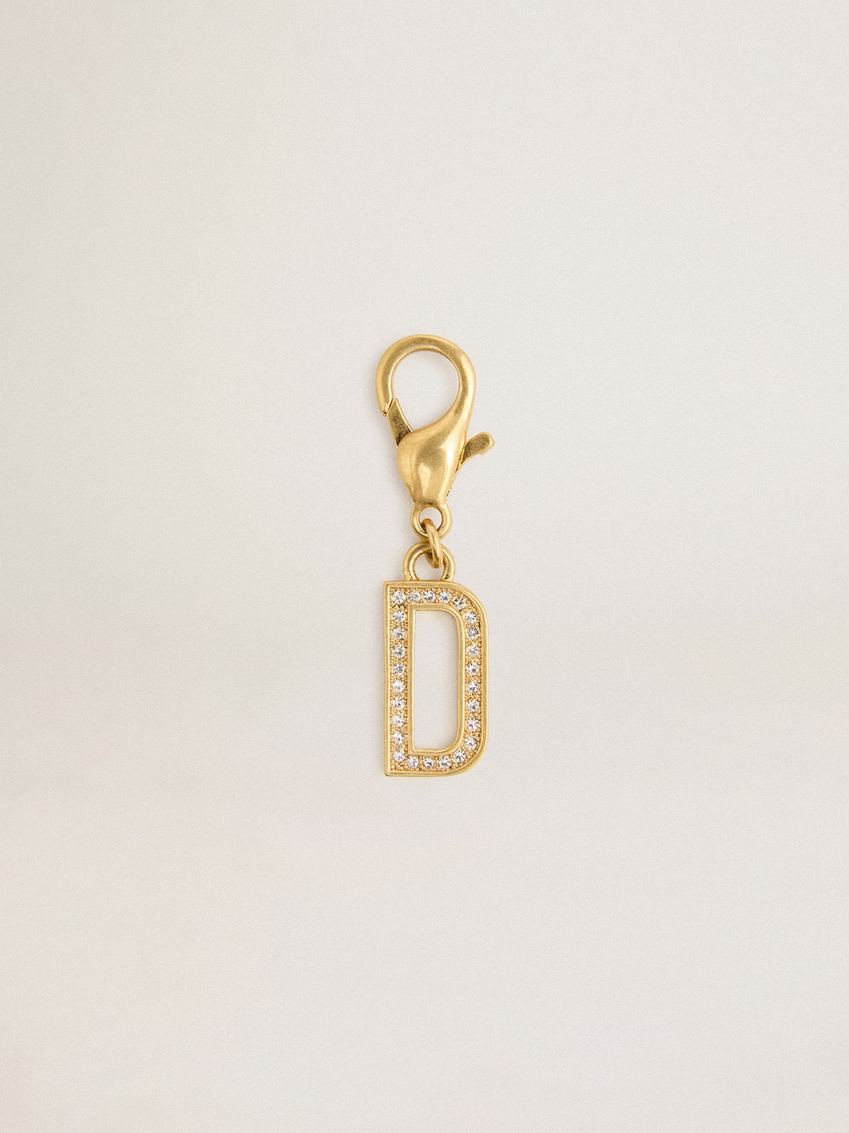 Letter D charm in gold-colored brass with crystals