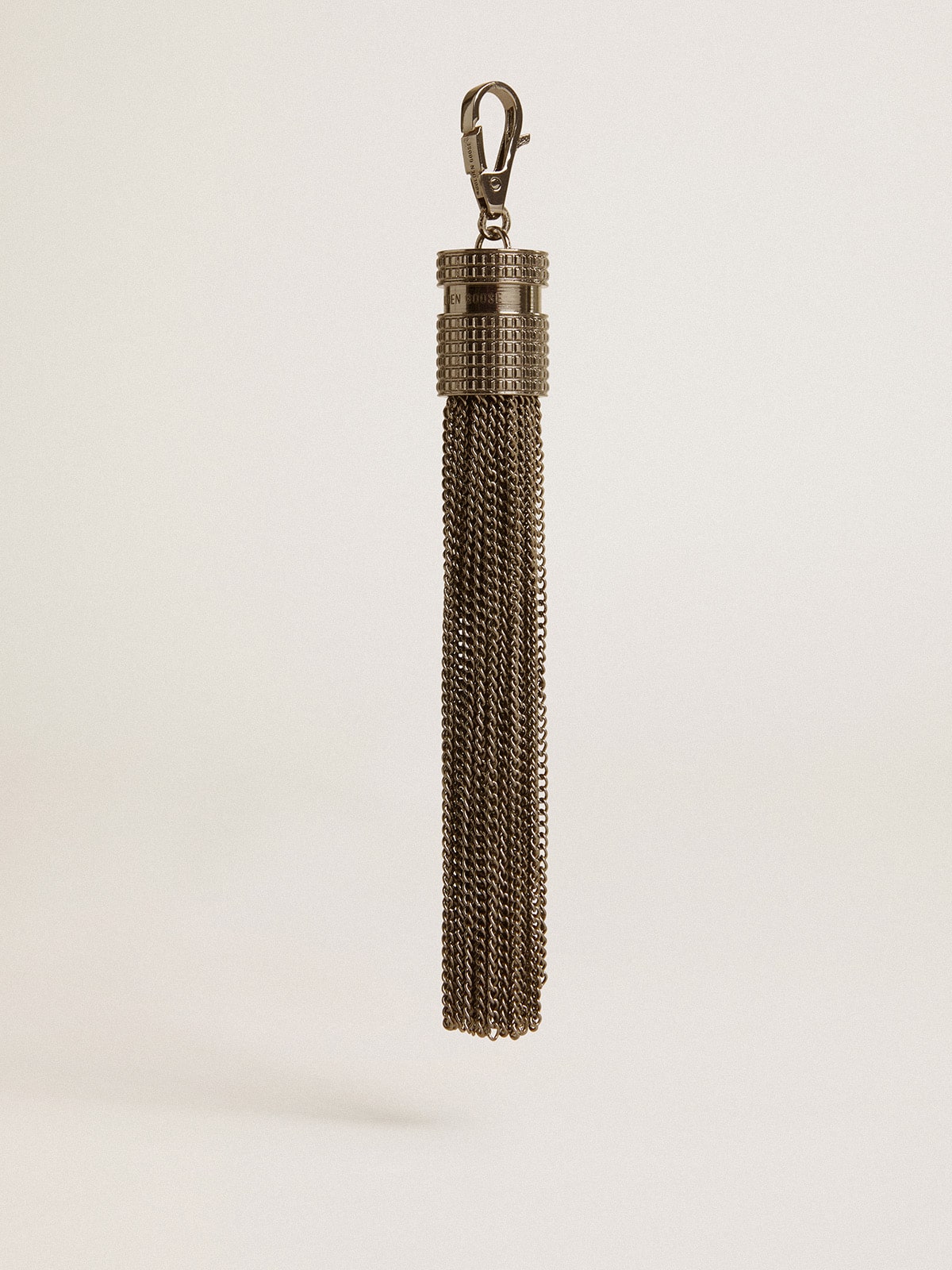Tassel-shaped charm in silver-colored brass with crystals